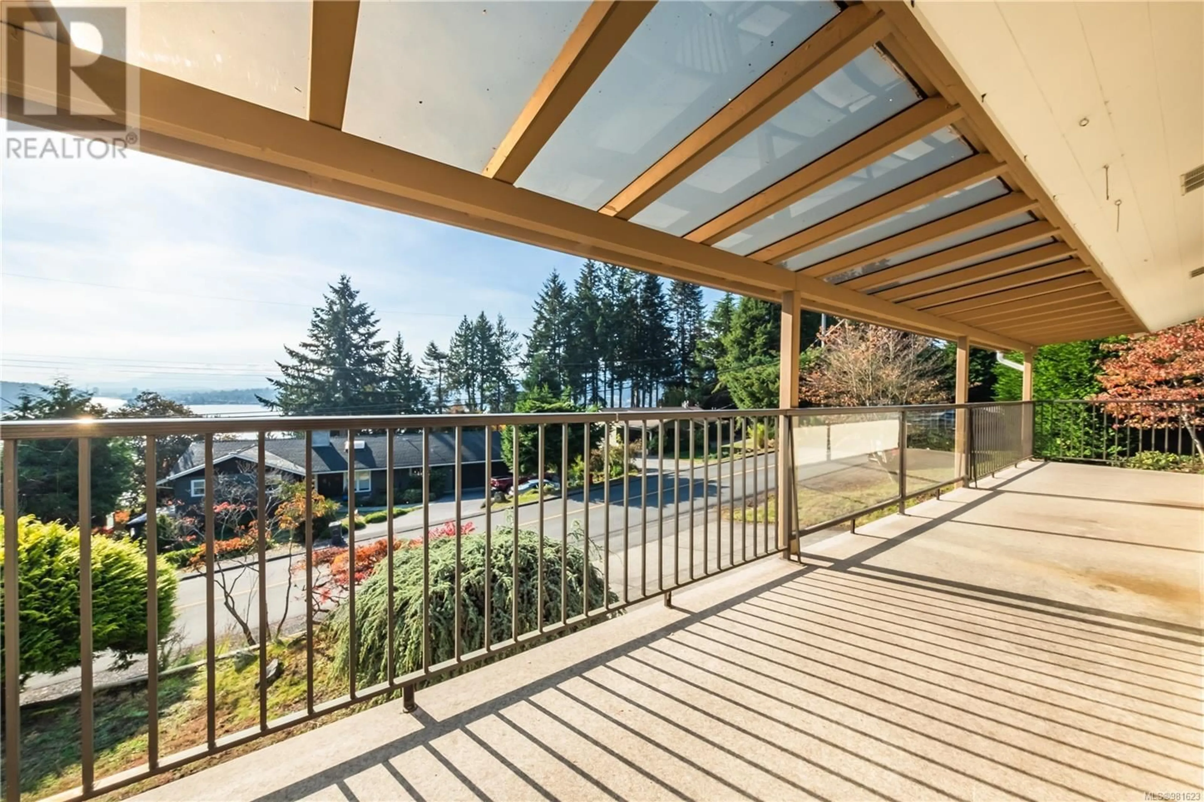 Patio, the fenced backyard for 181 Nottingham Dr, Nanaimo British Columbia V9T1K5