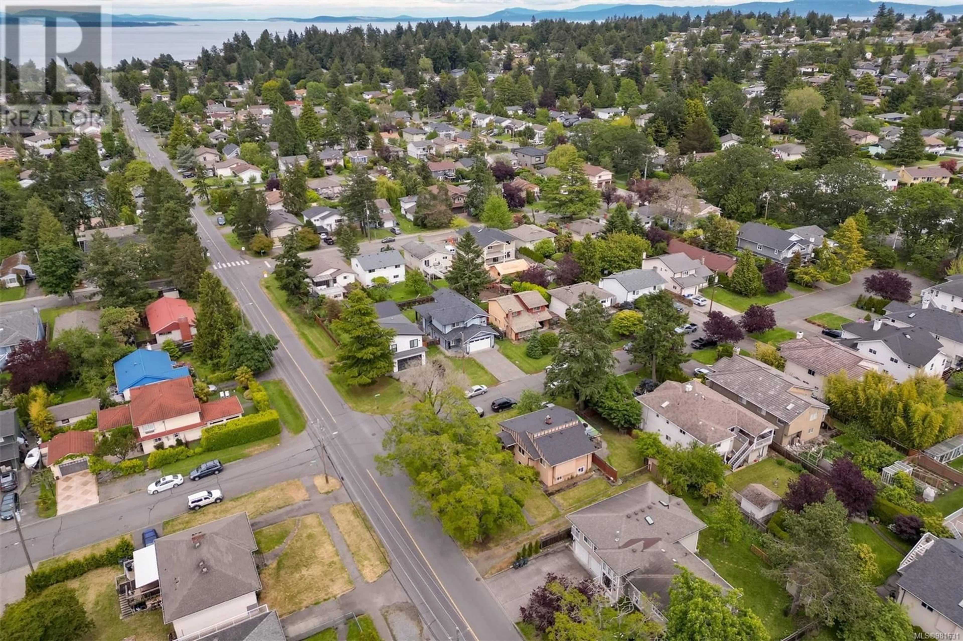 Frontside or backside of a home, the street view for 4335 Majestic Dr, Saanich British Columbia V8N3H1