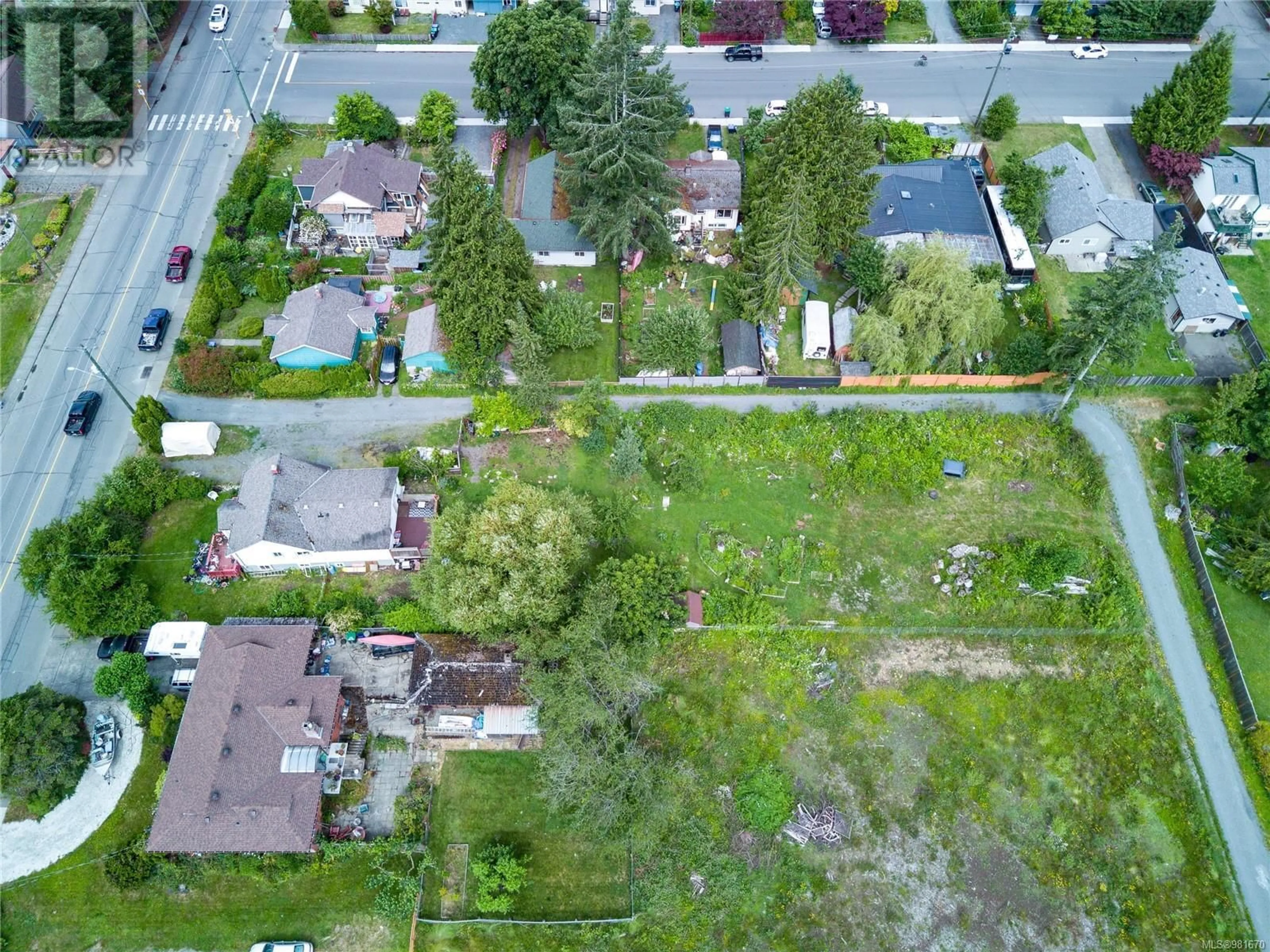 Frontside or backside of a home, the fenced backyard for 1530 Willemar Ave, Courtenay British Columbia V9N3M3