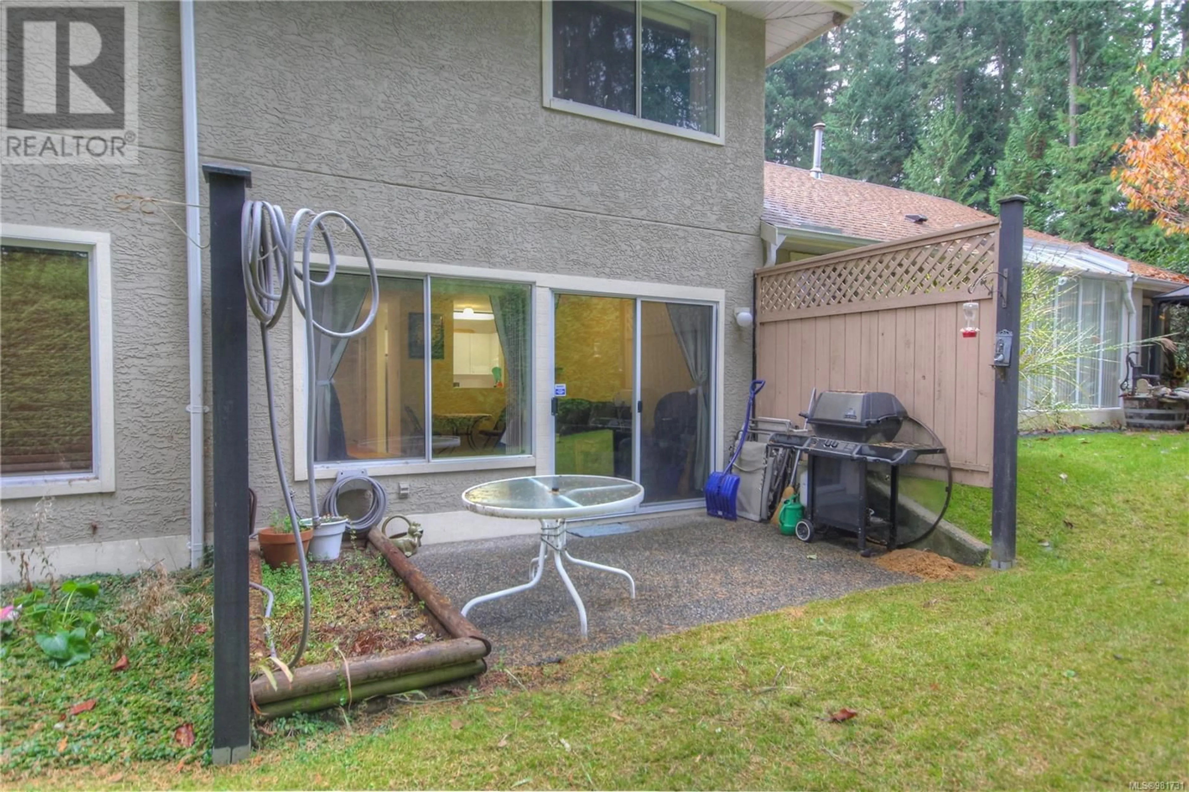 Patio, the fenced backyard for 6033 Pleasant Valley Way, Nanaimo British Columbia V9T6E7