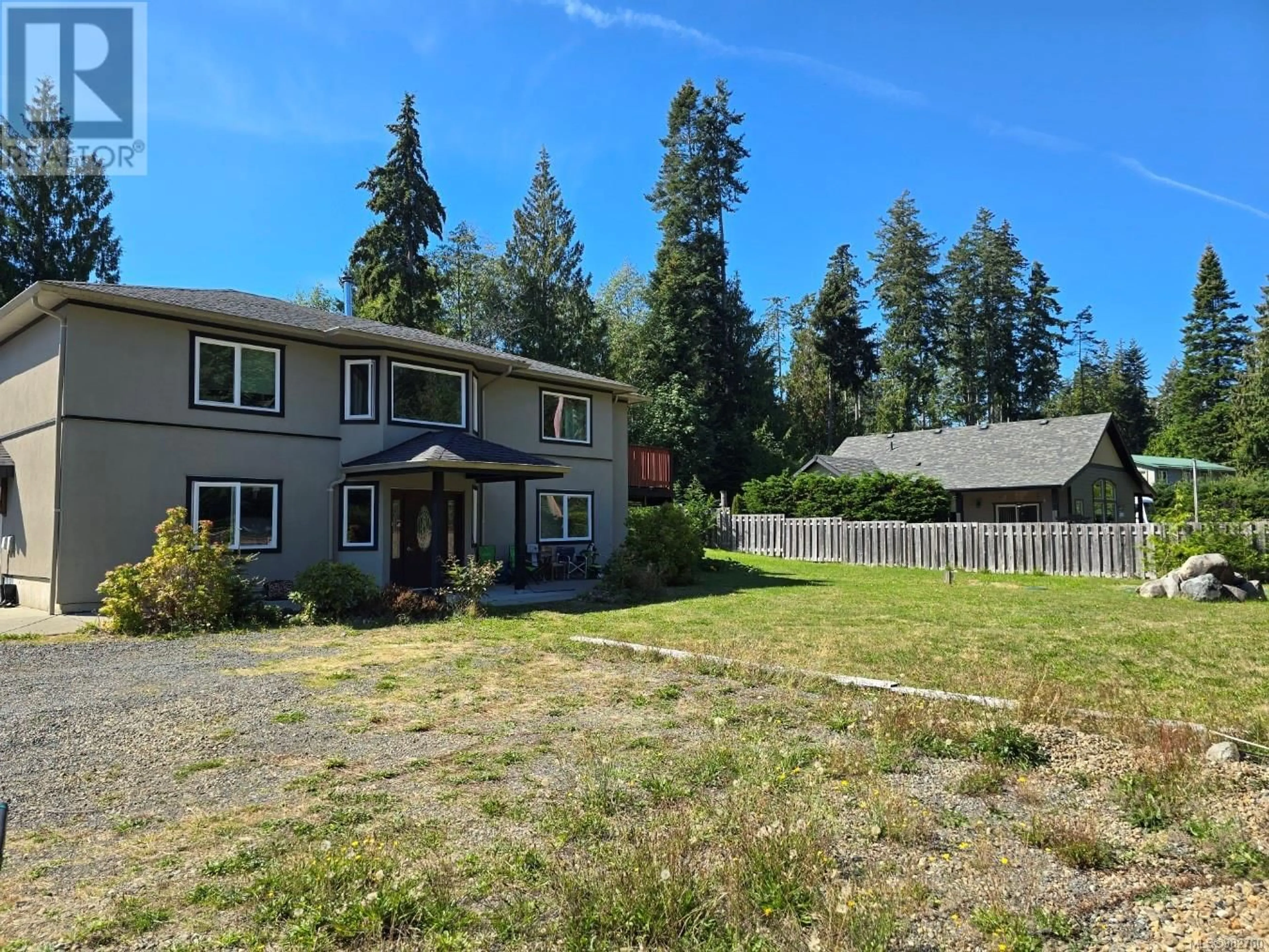 Frontside or backside of a home, the fenced backyard for 4594 Berbers Dr, Bowser British Columbia V0R1G0