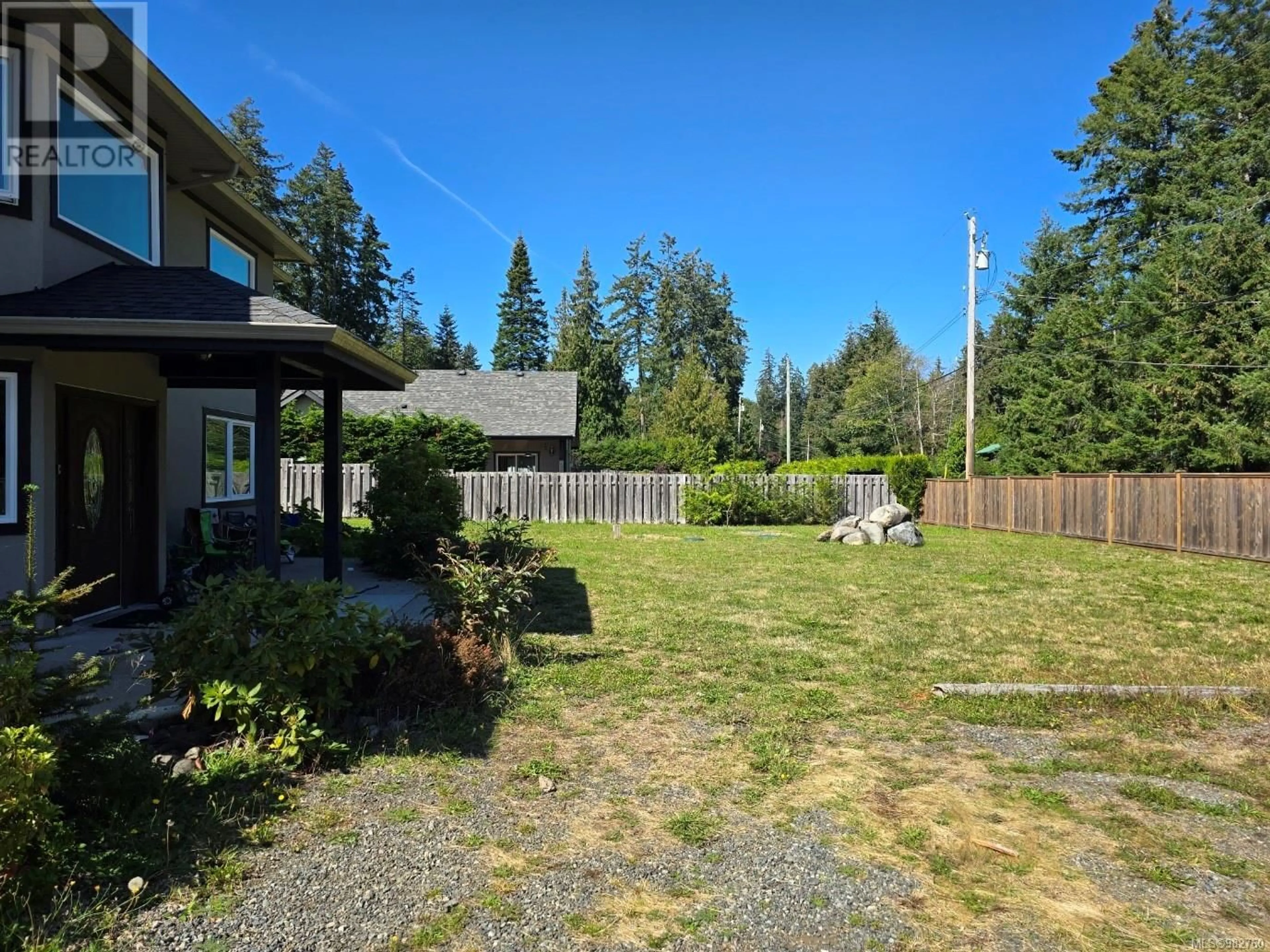 Frontside or backside of a home, the fenced backyard for 4594 Berbers Dr, Bowser British Columbia V0R1G0