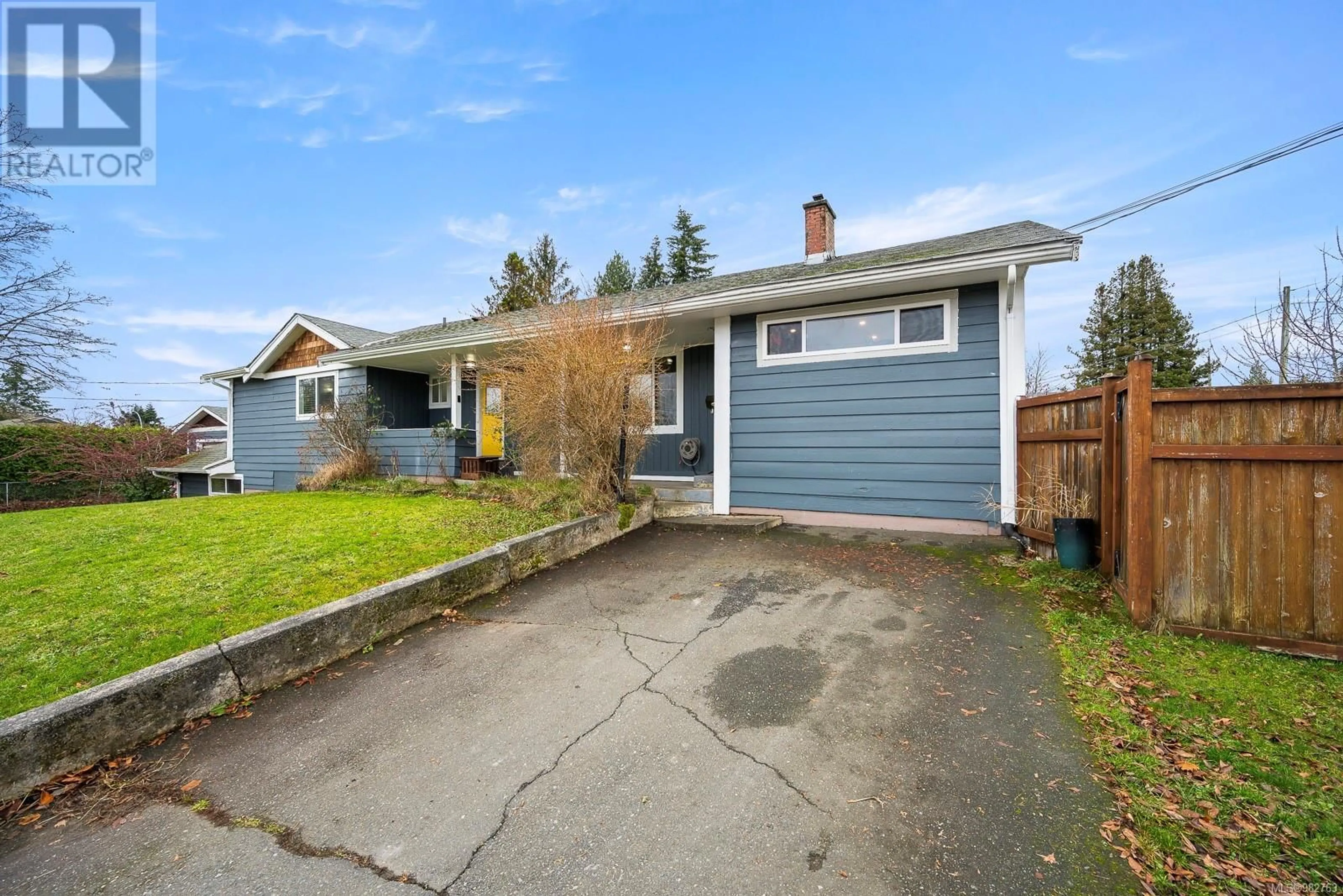 Frontside or backside of a home, the fenced backyard for 1815 Grieve Ave, Courtenay British Columbia V9N2W8