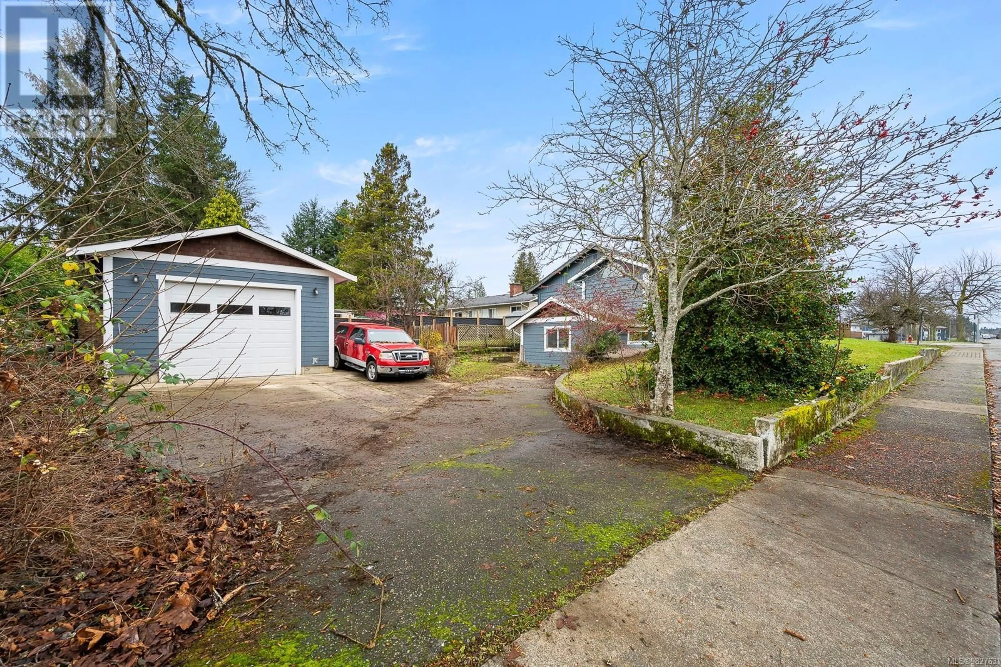 Frontside or backside of a home, the fenced backyard for 1815 Grieve Ave, Courtenay British Columbia V9N2W8