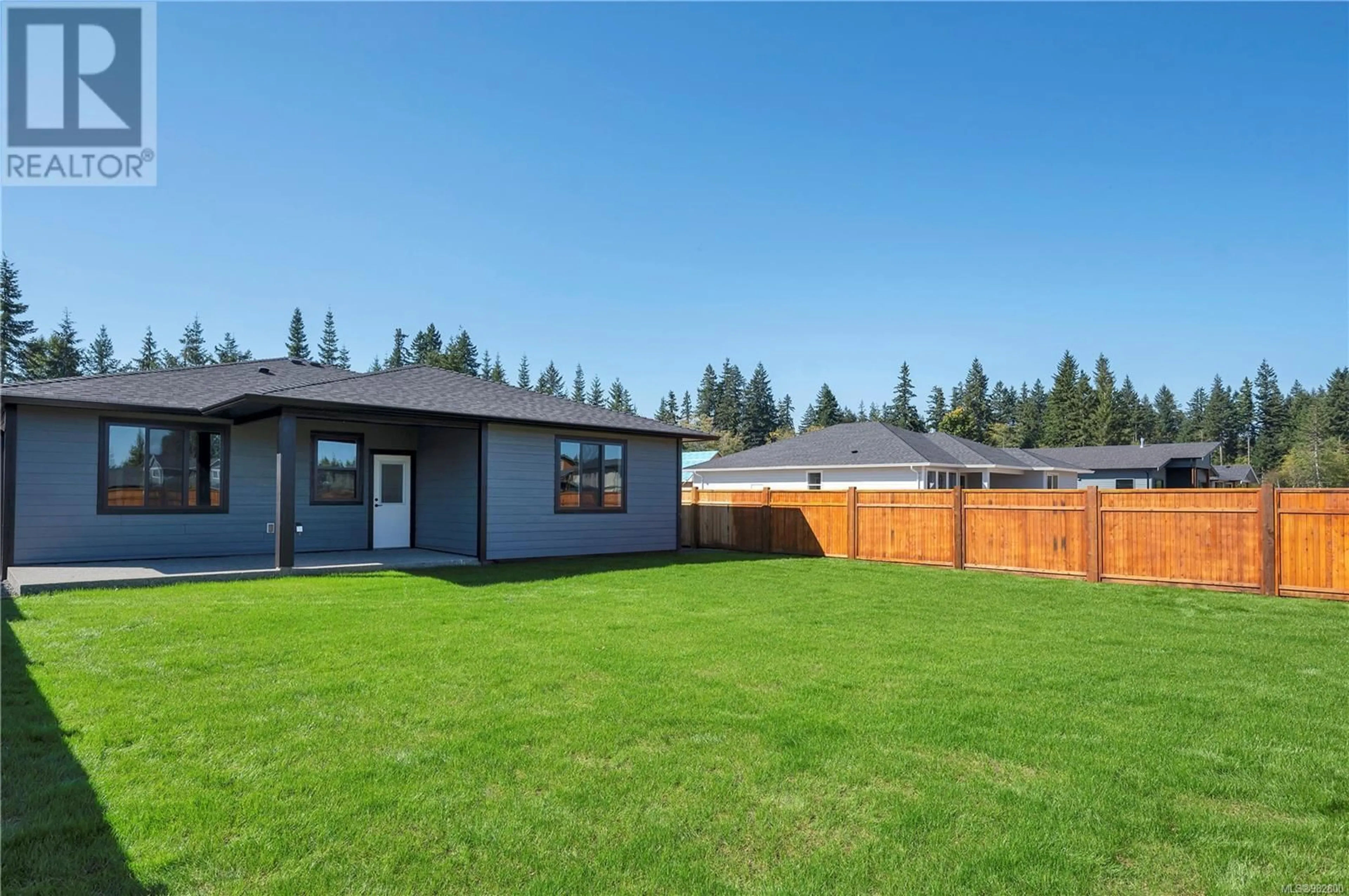 Frontside or backside of a home, the fenced backyard for 716 Salmonberry St, Campbell River British Columbia V9H0G1