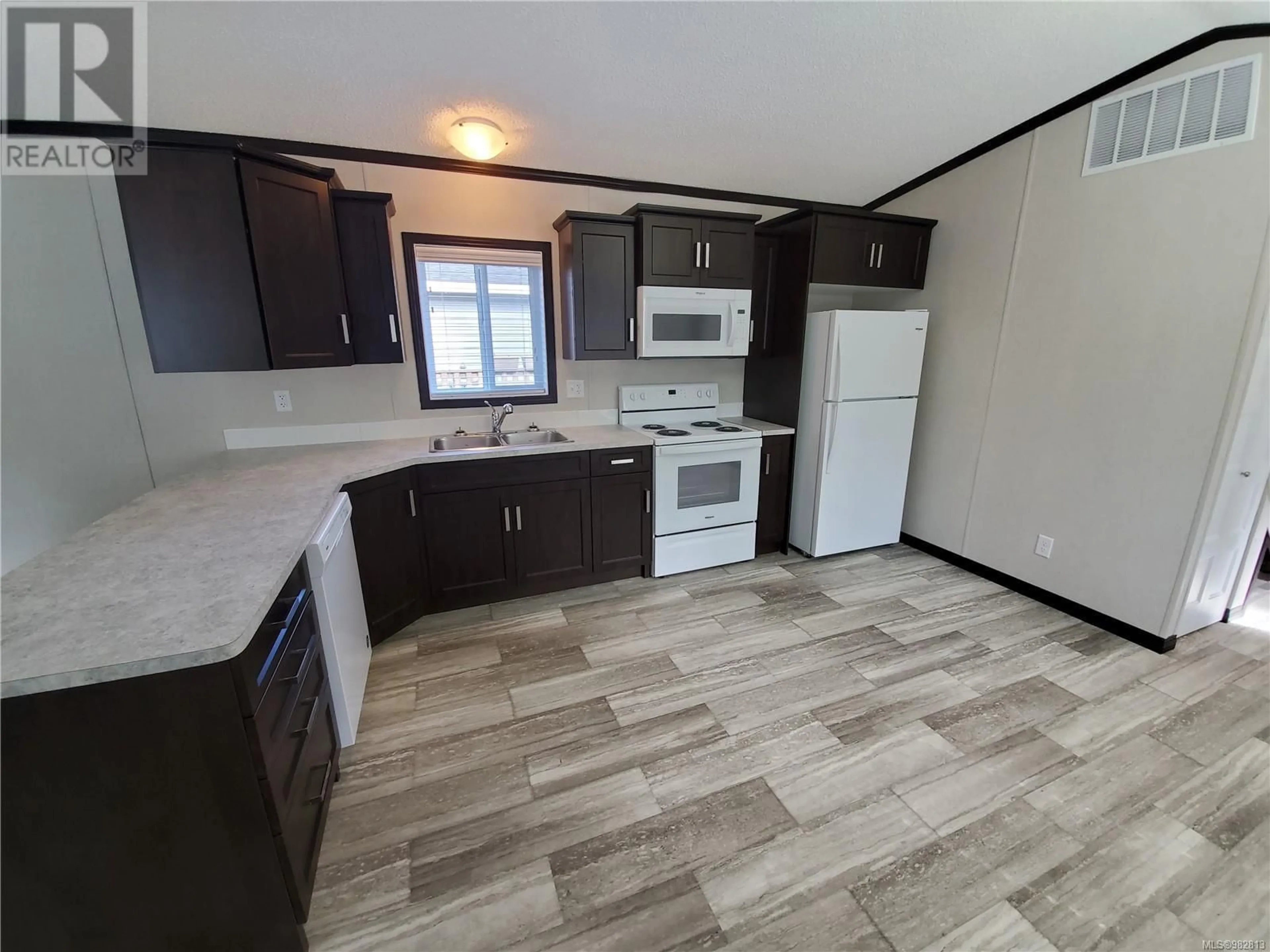 Standard kitchen, wood floors, cottage for 52 1720 Whibley Rd, Coombs British Columbia V0R1M0