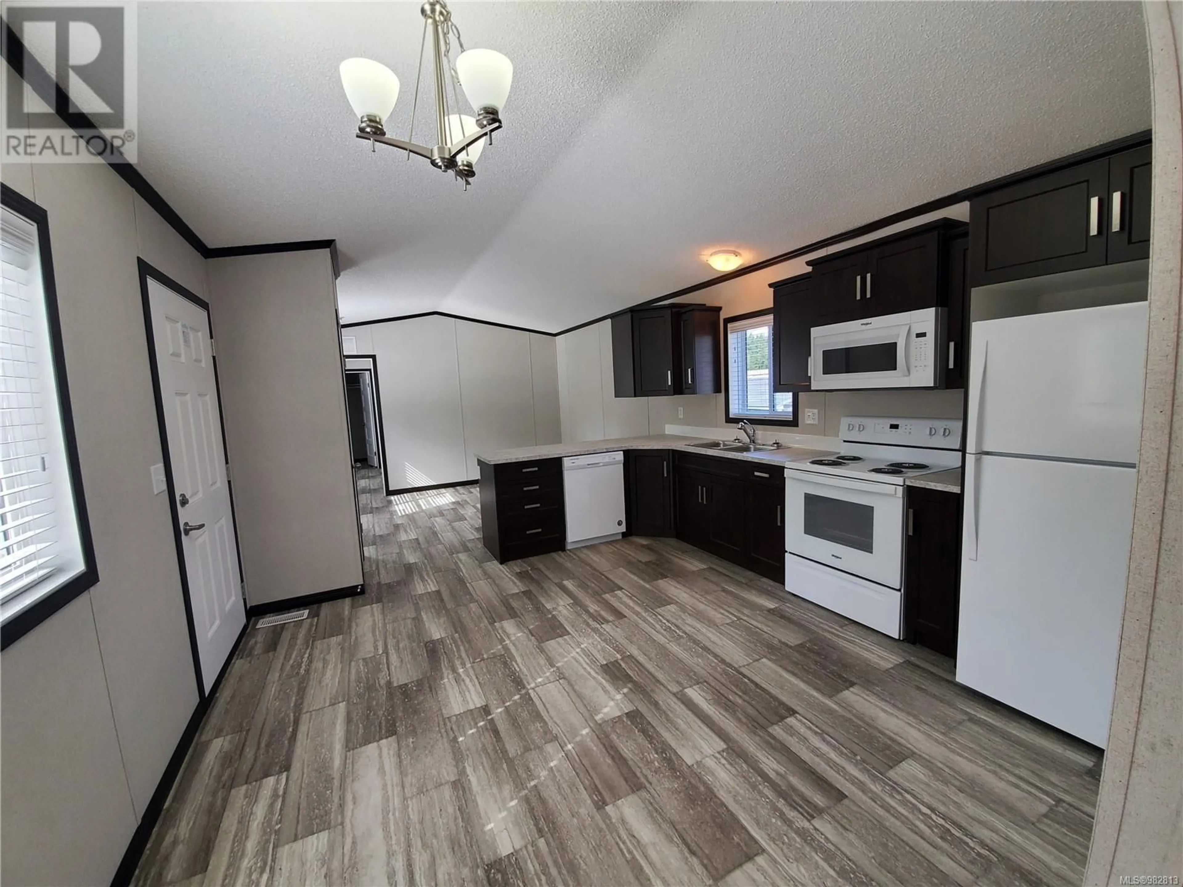 Open concept kitchen for 52 1720 Whibley Rd, Coombs British Columbia V0R1M0