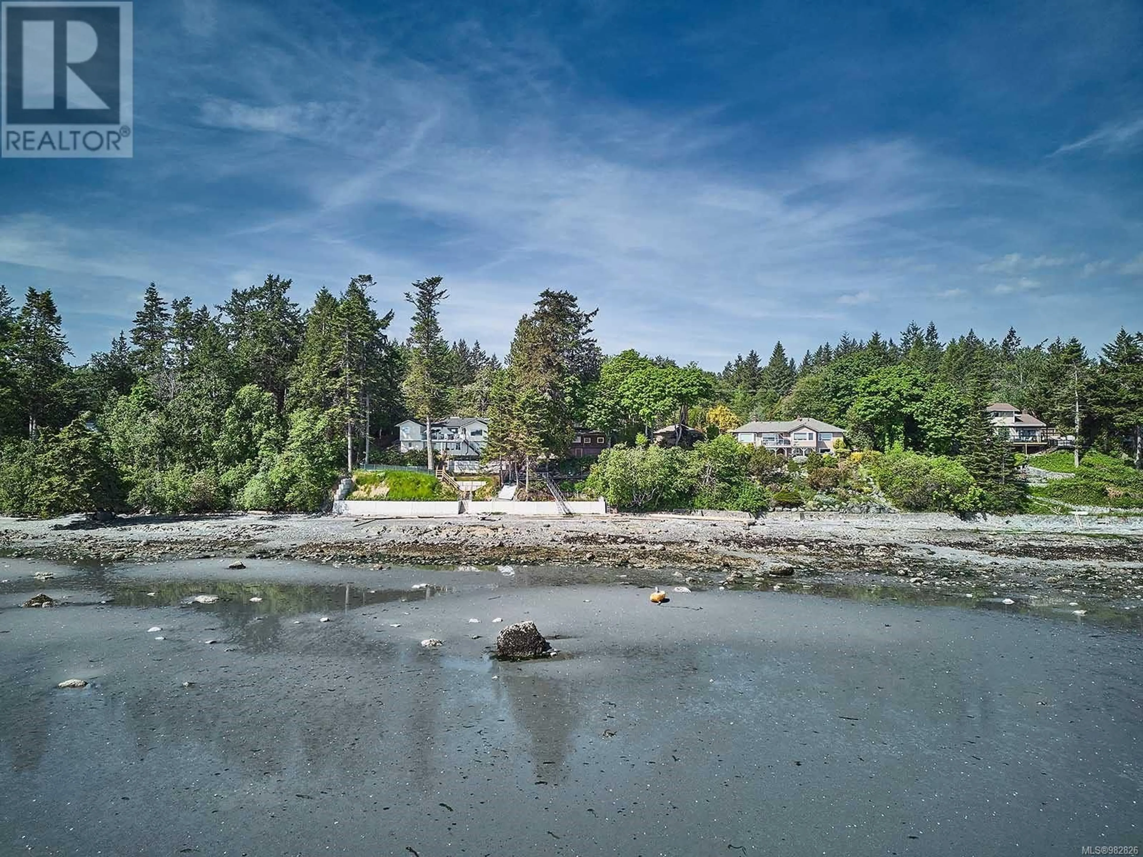 A pic from outside/outdoor area/front of a property/back of a property/a pic from drone, water/lake/river/ocean view for 9005 Lochside Dr, North Saanich British Columbia V8L1N1