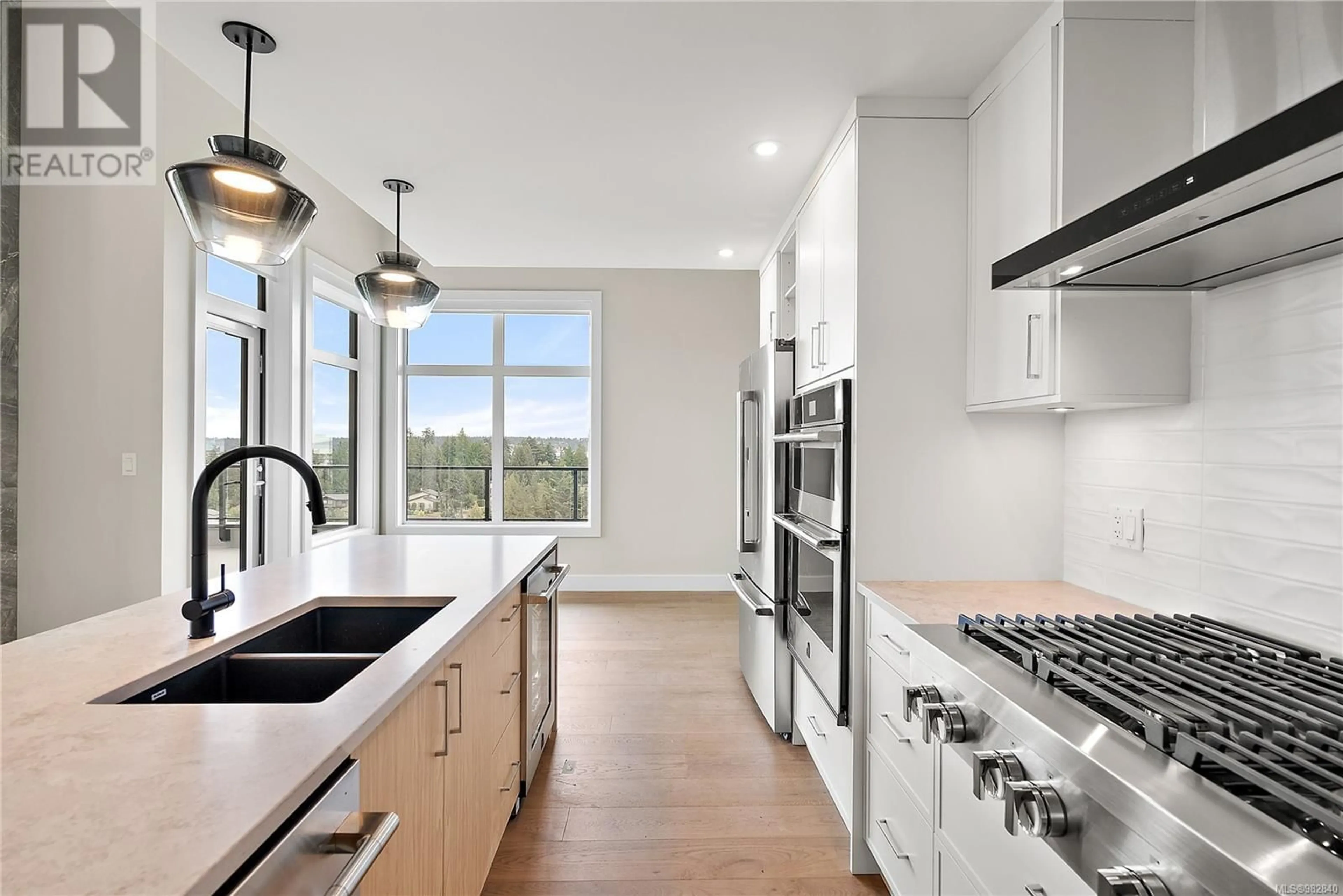 Open concept kitchen, ceramic/tile floor for 103 2520 Hackett Cres, Central Saanich British Columbia V8M0B9