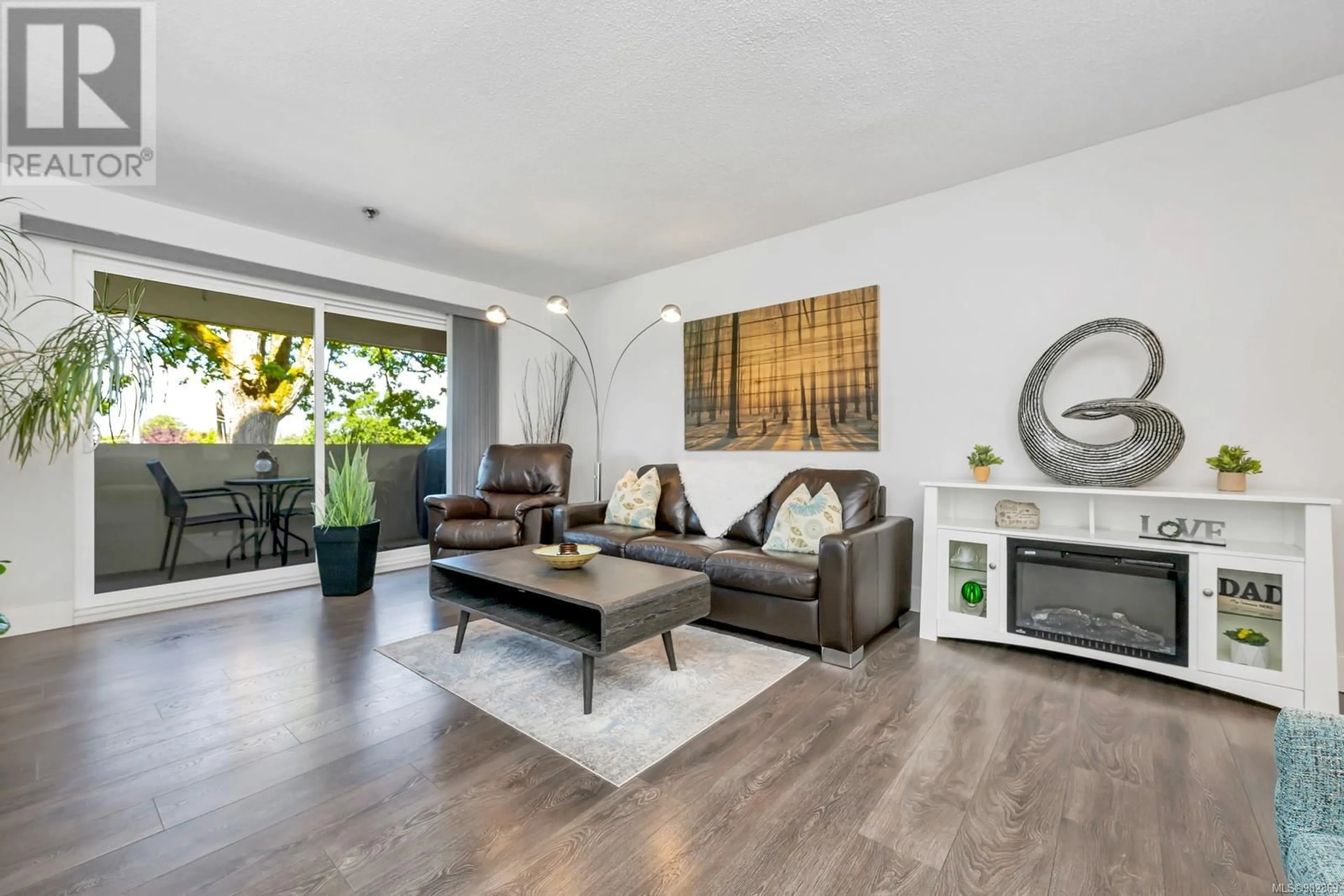 Living room, wood floors for 104 3277 Glasgow Ave, Saanich British Columbia V8X1M3