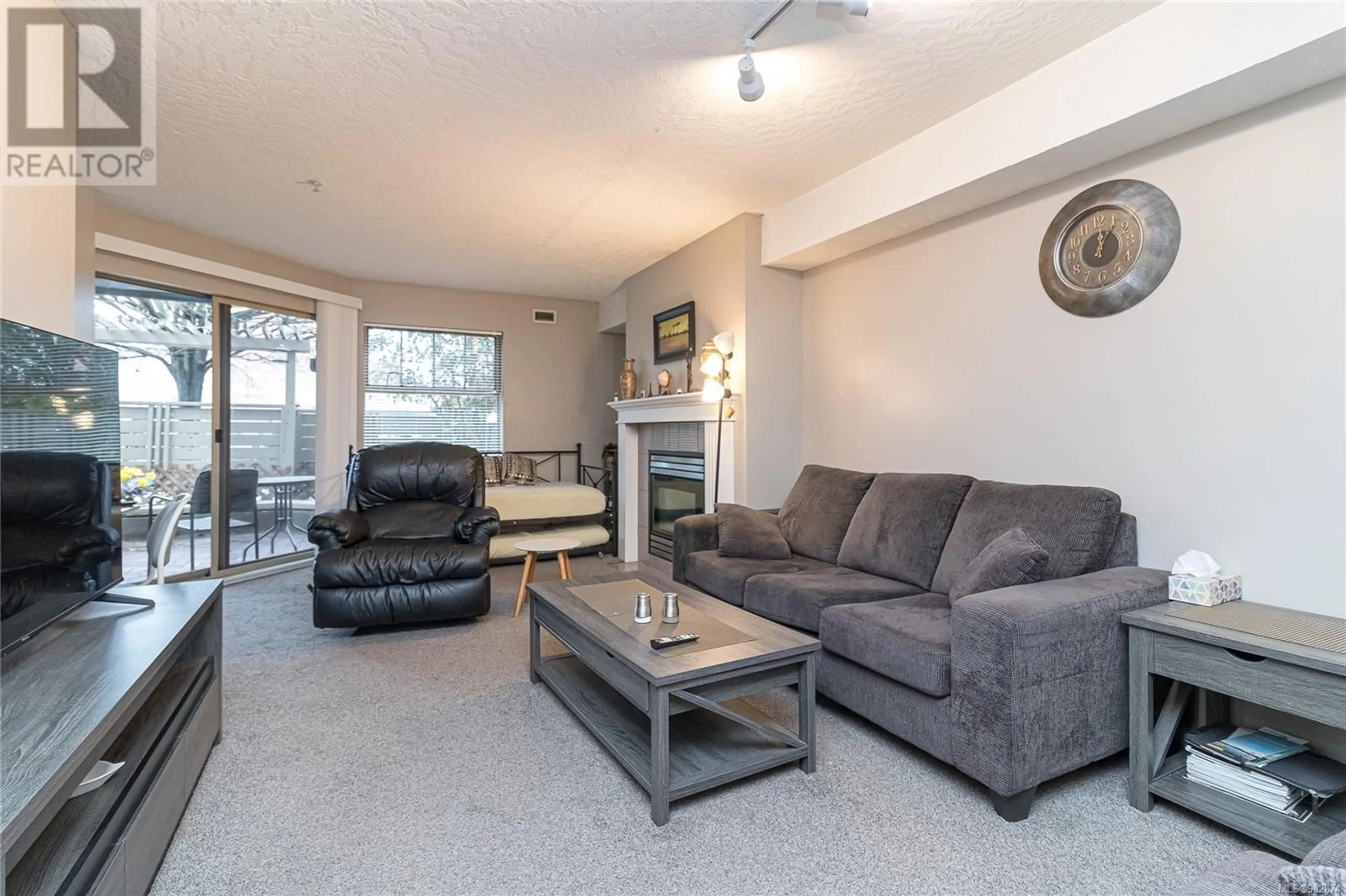 Living room, carpet floors for 109 935 Johnson St, Victoria British Columbia V8V3N5