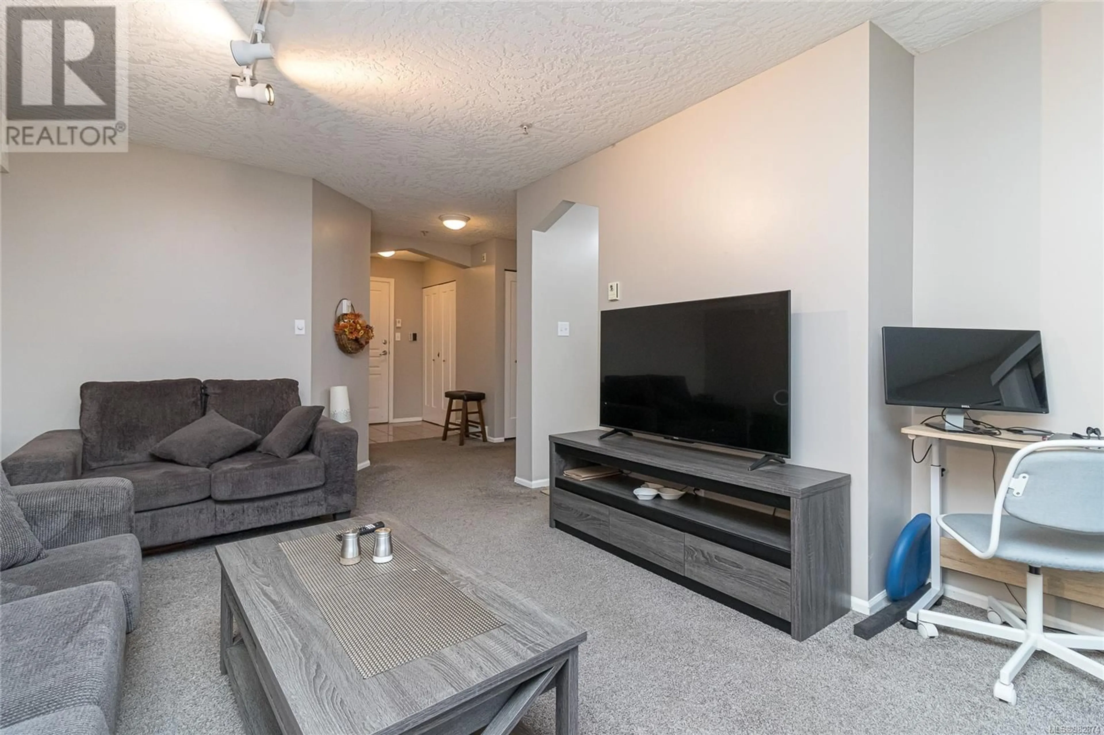 Living room, cement floor for 109 935 Johnson St, Victoria British Columbia V8V3N5