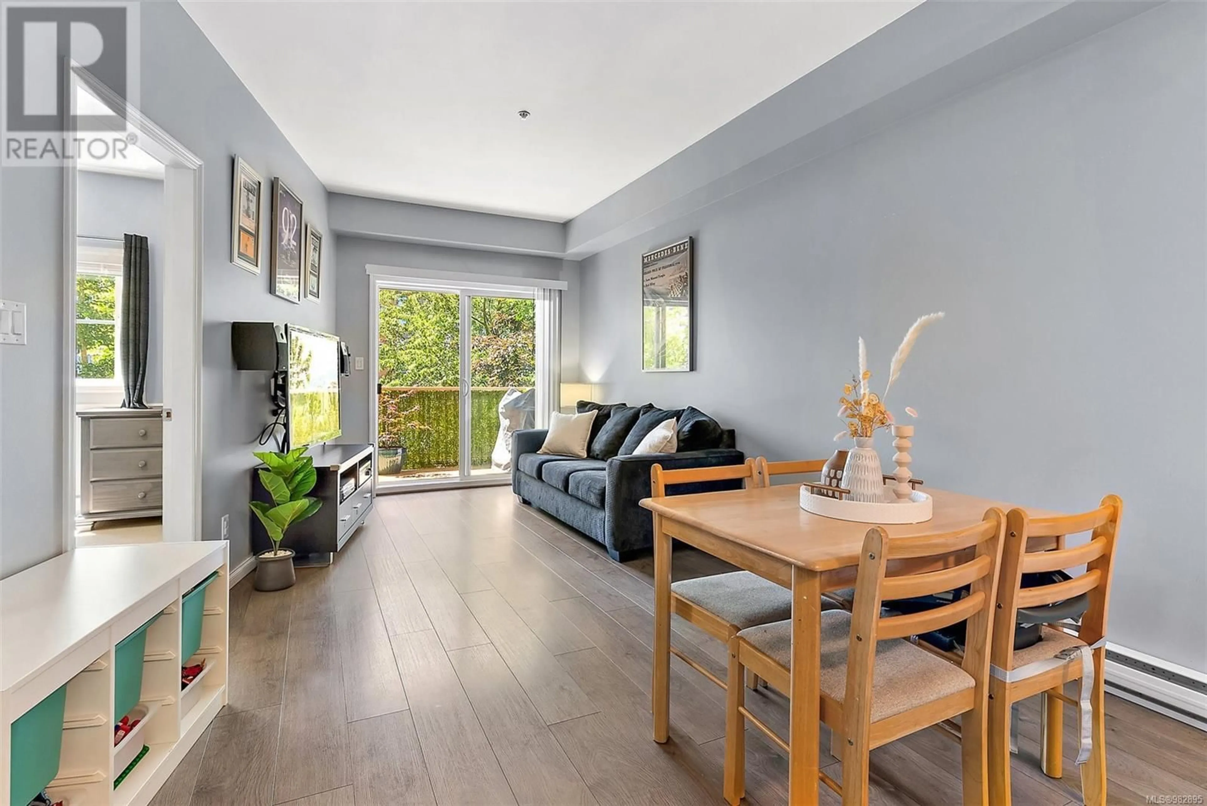 Living room with furniture, wood/laminate floor for 205 821 Goldstream Ave, Langford British Columbia V9B2X8