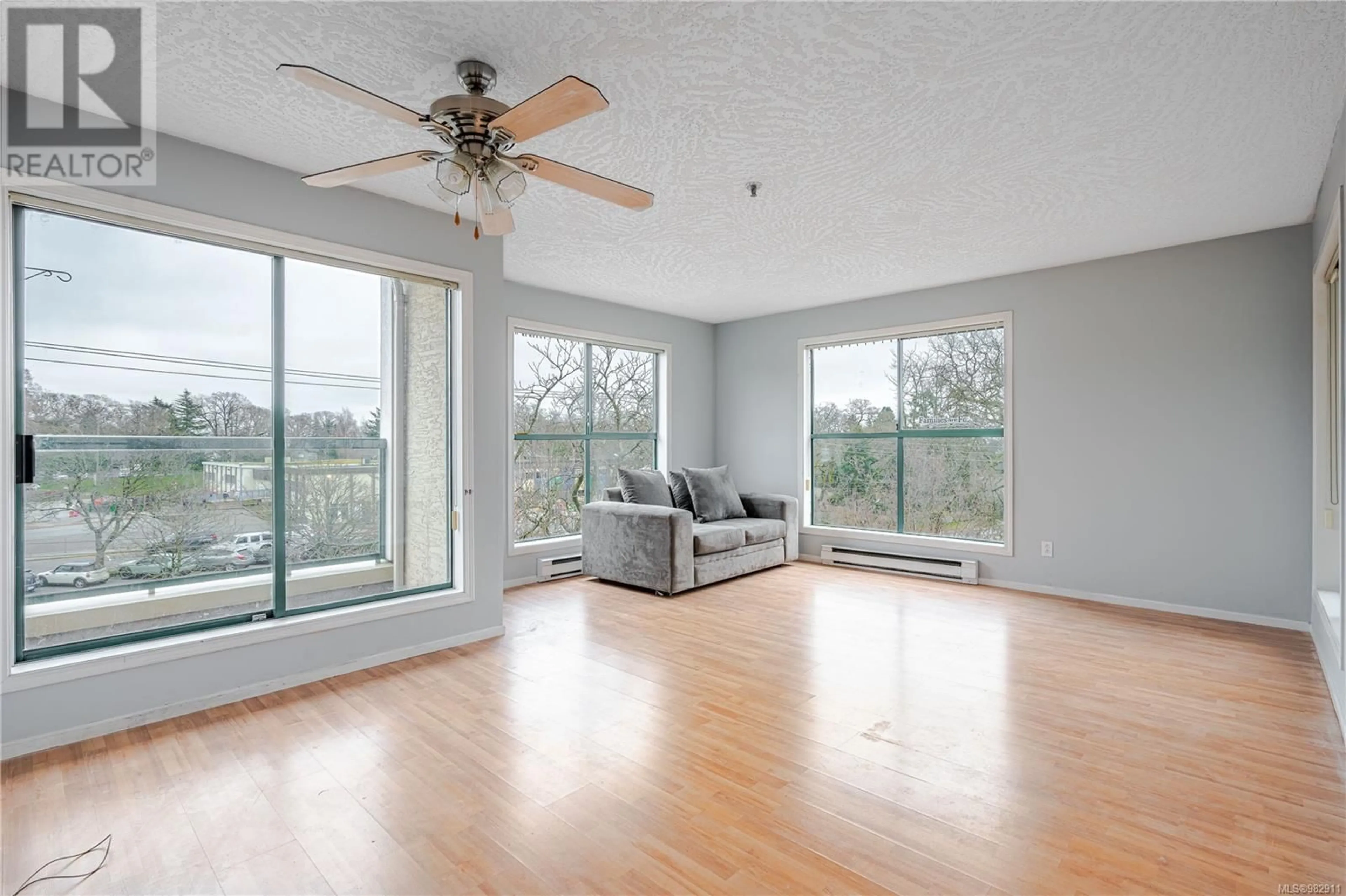 Living room, wood floors for 307 3460 Quadra St, Saanich British Columbia V8X1G6