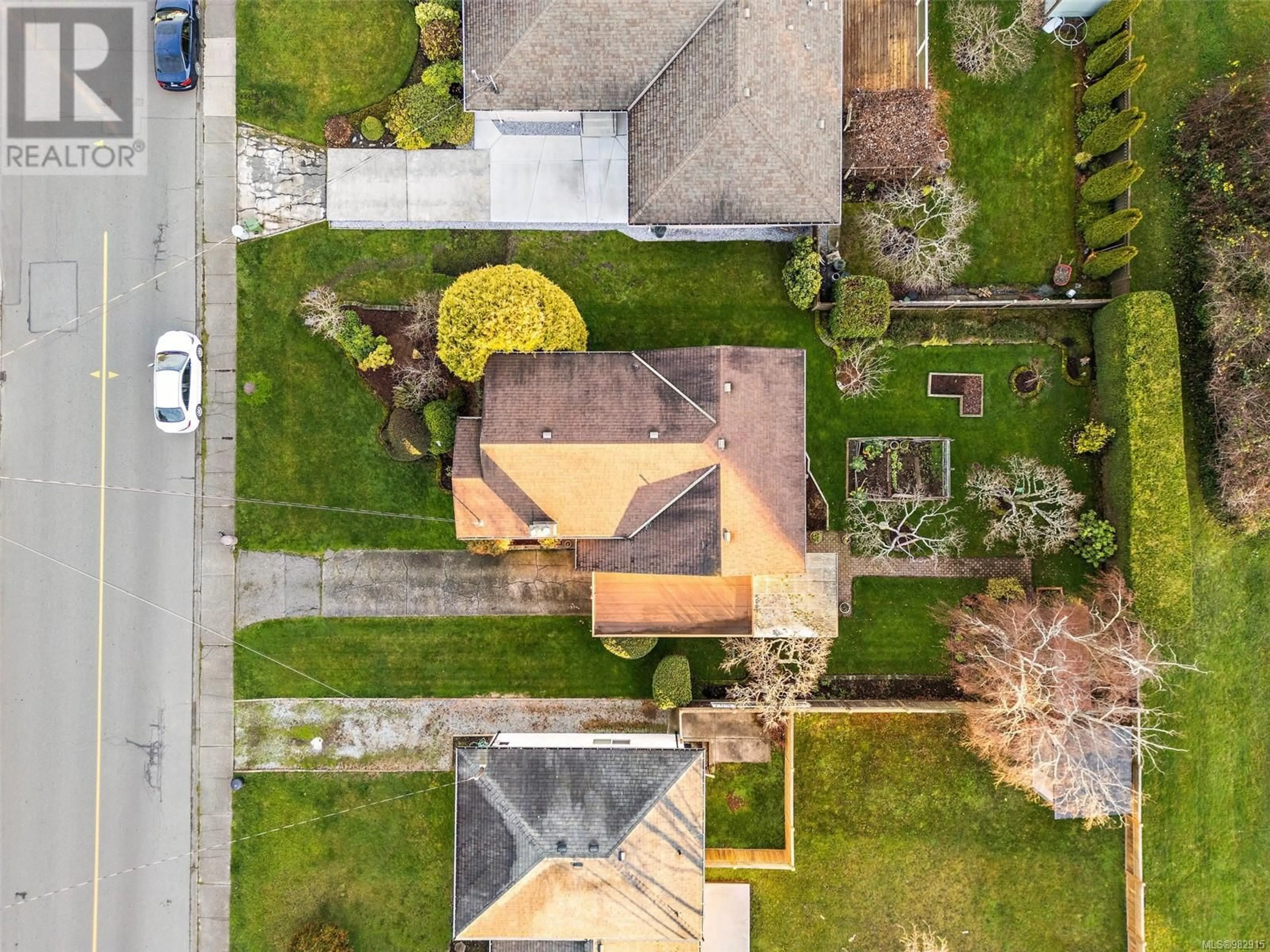 A pic from outside/outdoor area/front of a property/back of a property/a pic from drone, street for 2249 Ardwell Ave, Sidney British Columbia V8L2M2