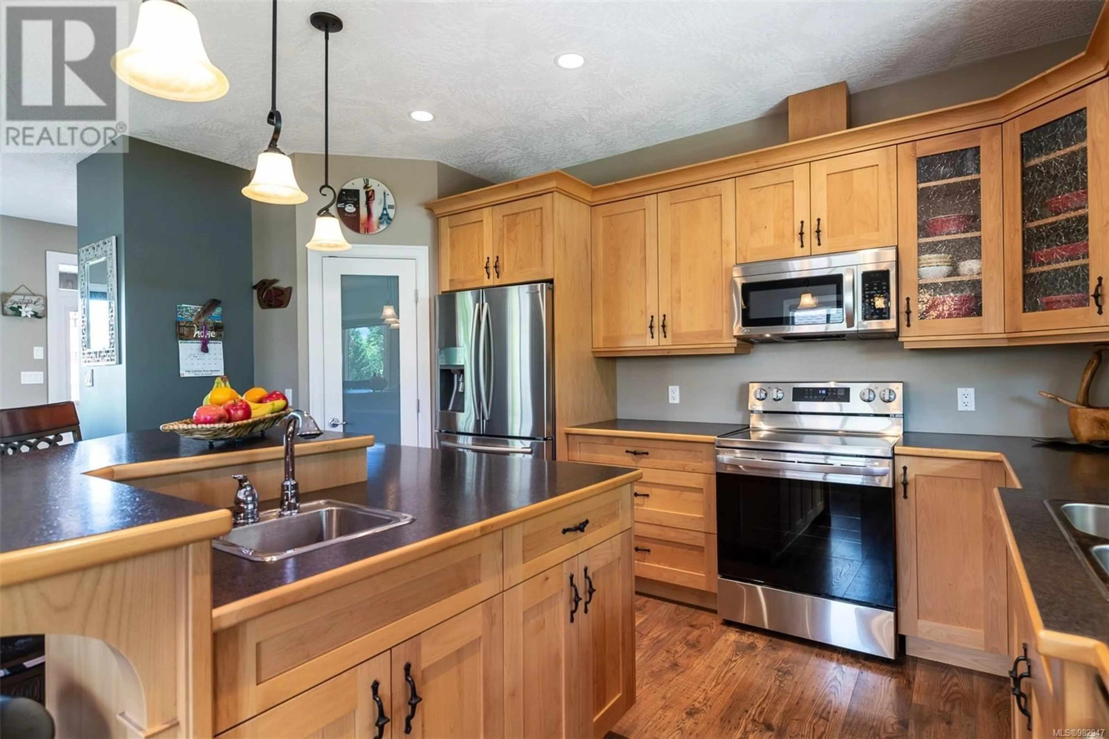 Open concept kitchen, wood/laminate floor for 493 Mountain View Dr, Lake Cowichan British Columbia V0R2G1