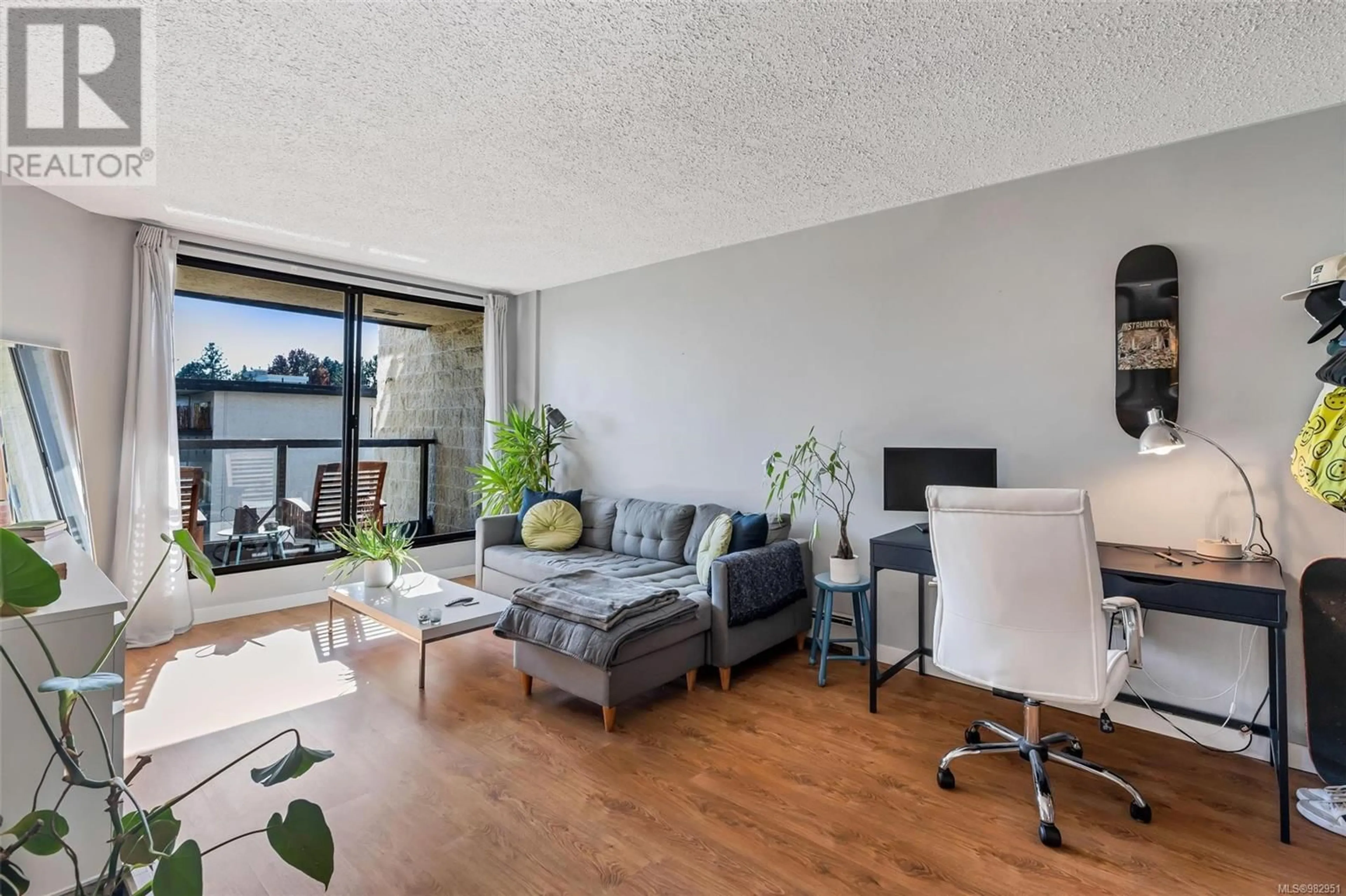 Living room with furniture, wood/laminate floor for 414 1745 Leighton Rd, Victoria British Columbia V8R6R6