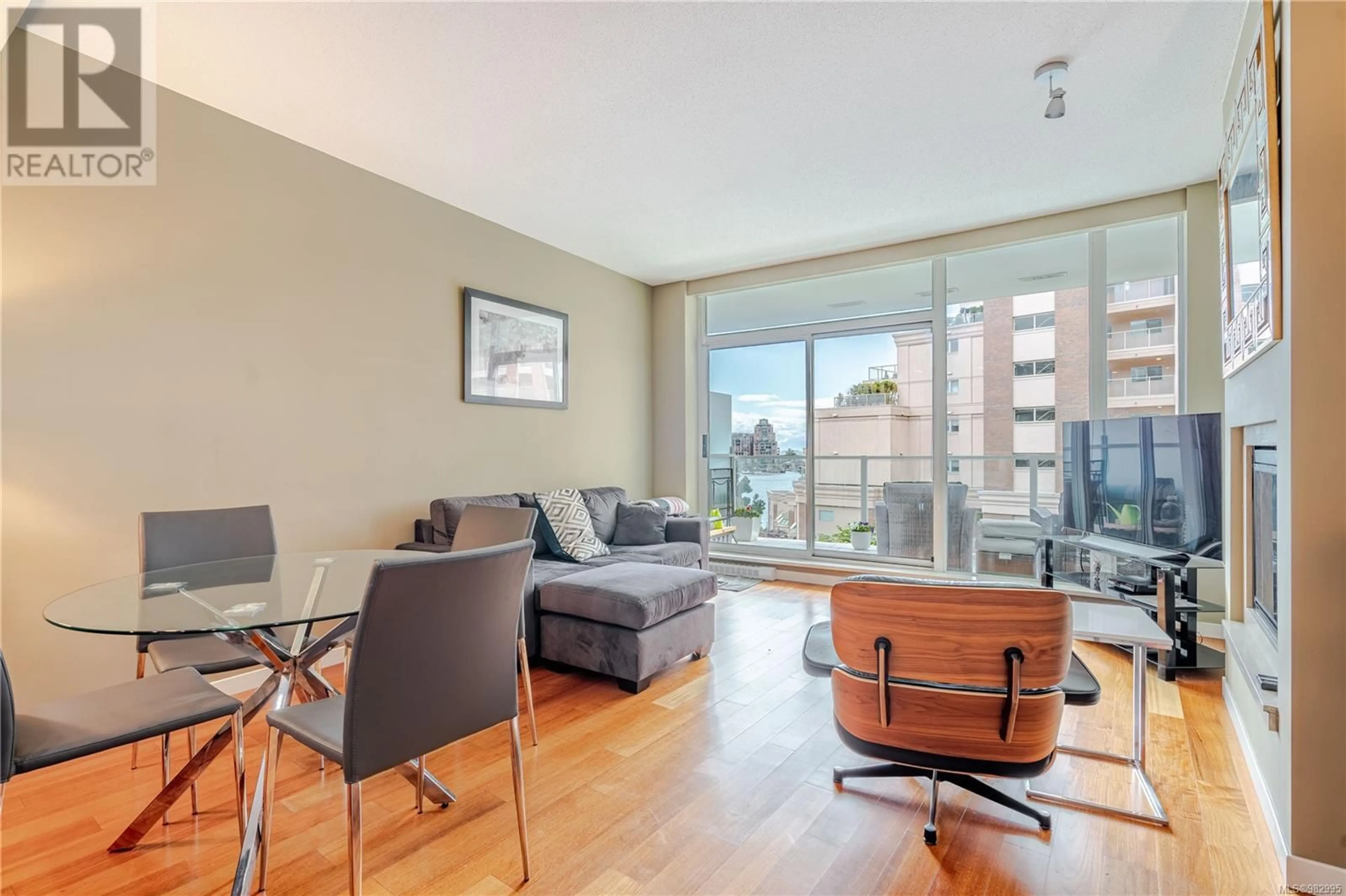 Living room with furniture, wood/laminate floor for 304 68 Songhees Rd, Victoria British Columbia V9A0A3