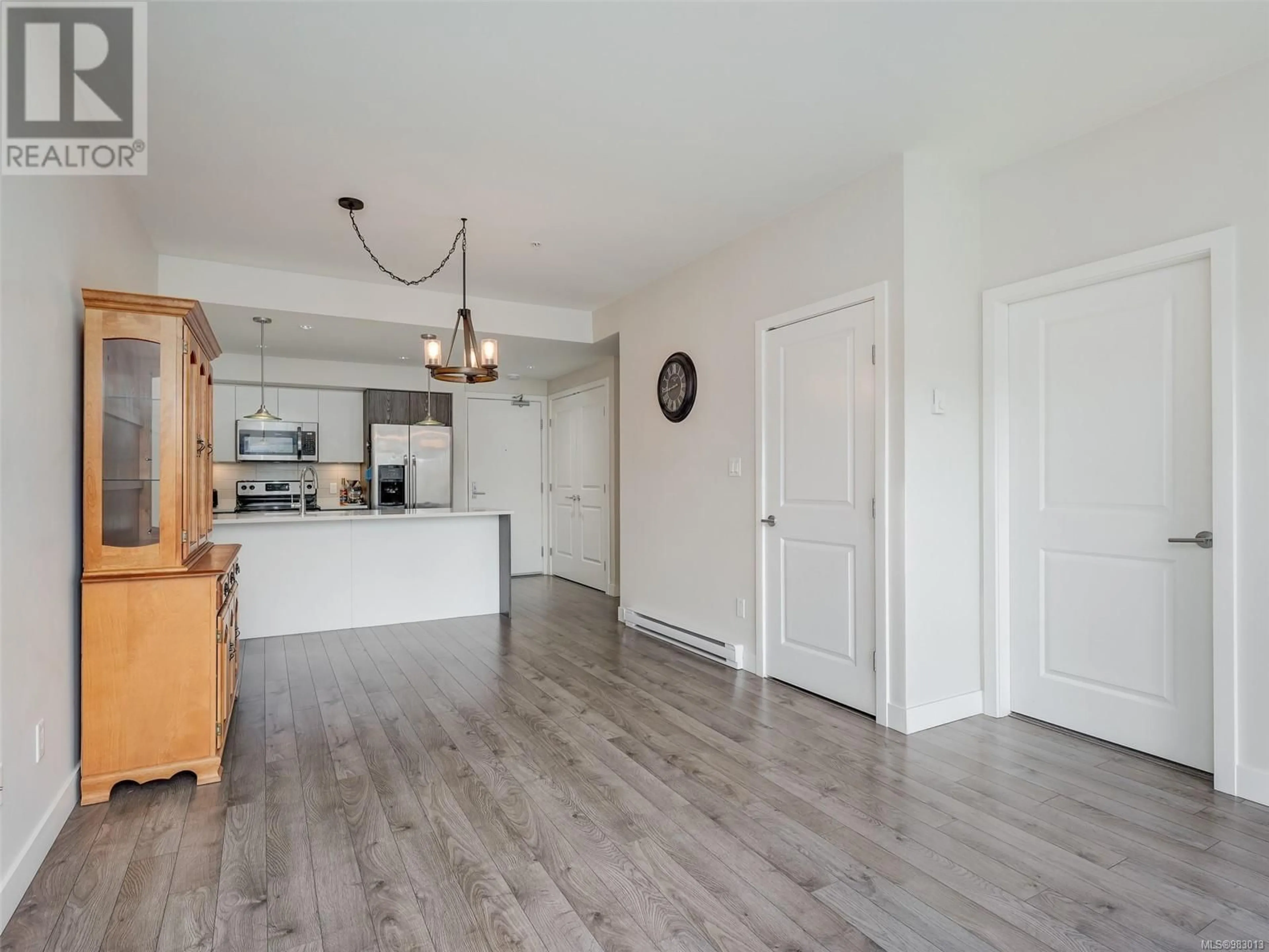 Open concept kitchen, wood/laminate floor for 305 1000 Inverness Rd, Saanich British Columbia V8X2S1