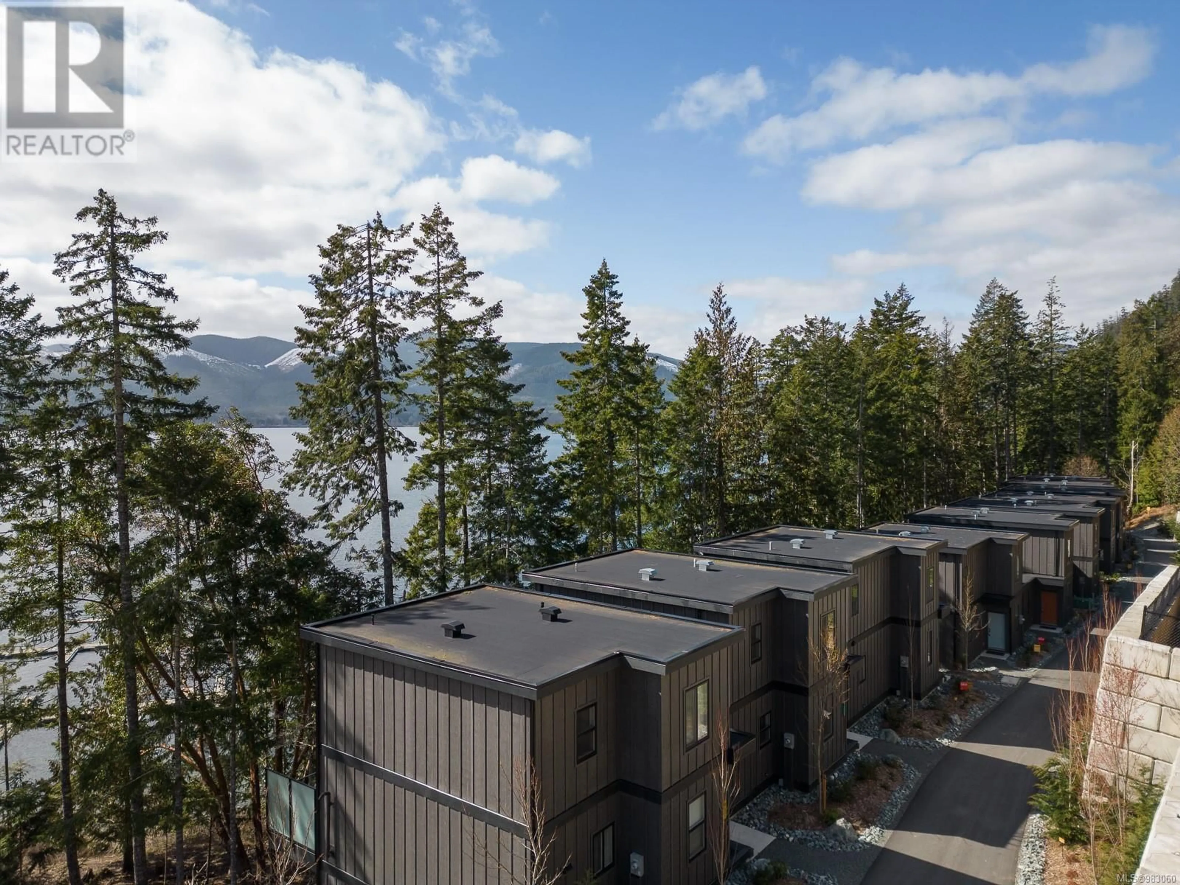 A pic from outside/outdoor area/front of a property/back of a property/a pic from drone, water/lake/river/ocean view for 1 - 7470 COTTAGE WAY, Lake Cowichan British Columbia V0R2G1