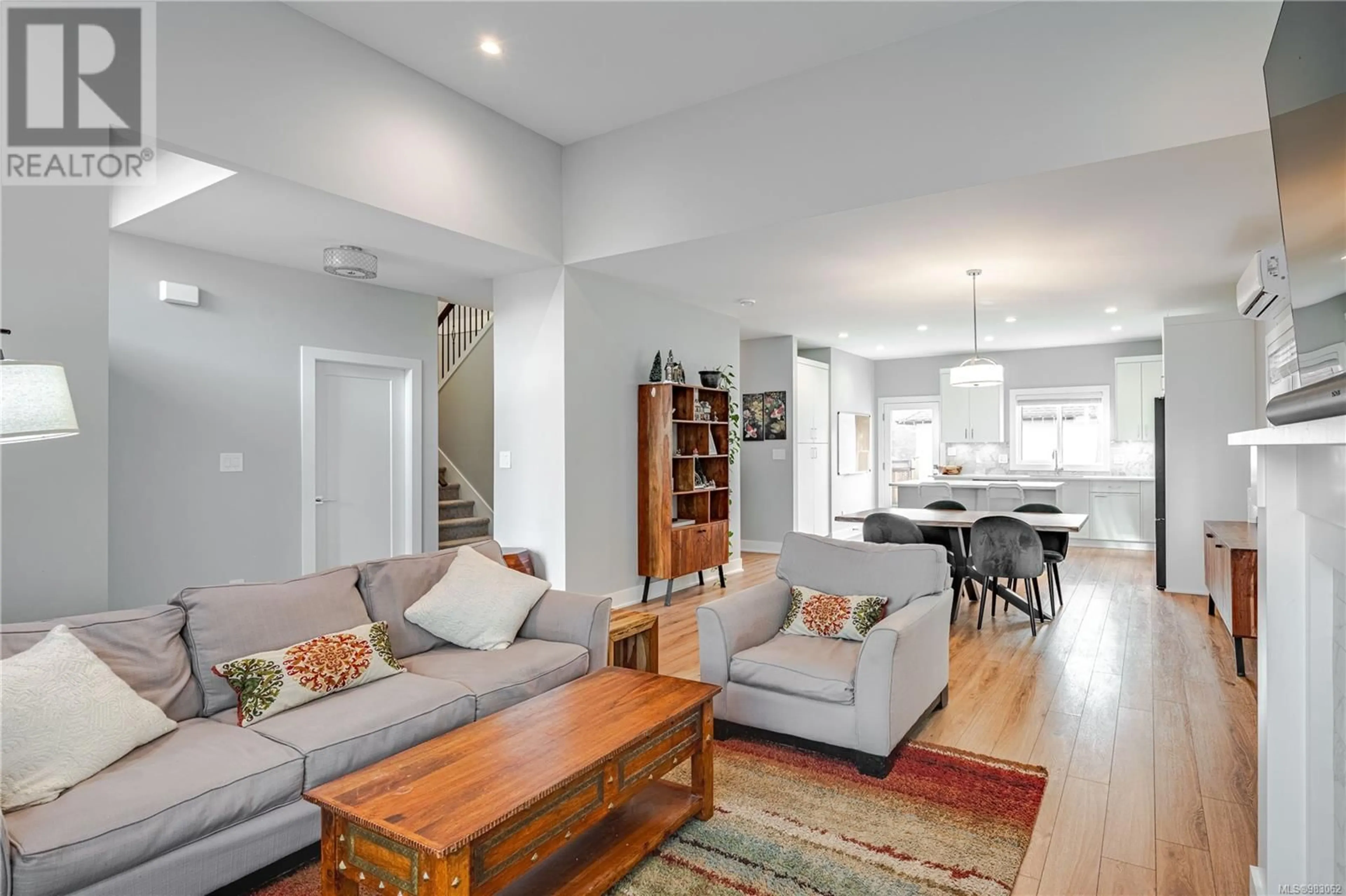 Living room with furniture, wood/laminate floor for 2935 Constellation Ave, Langford British Columbia V9B6Z7