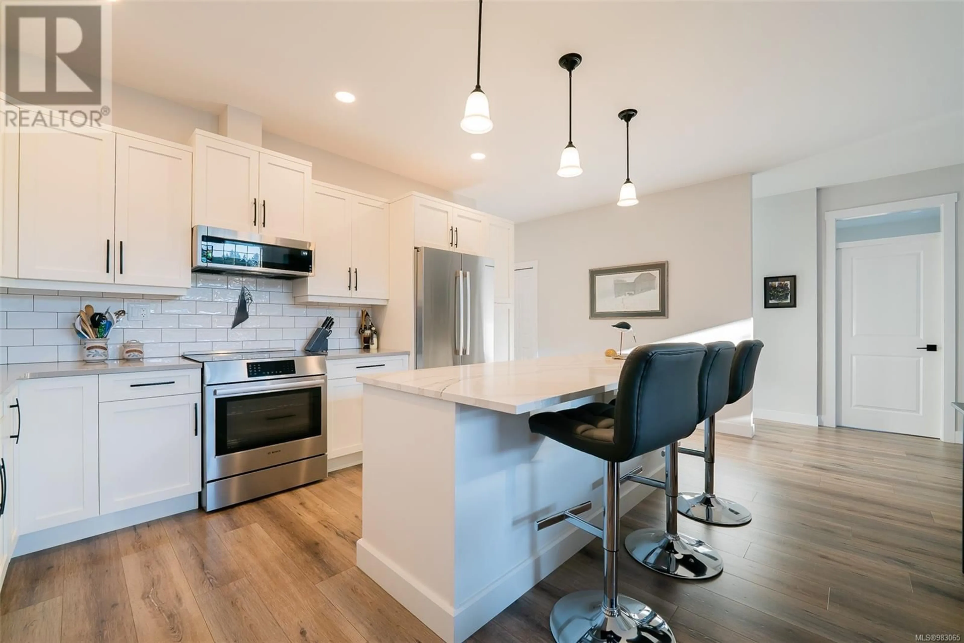 Open concept kitchen, wood/laminate floor for 526 Rothdale Rd, Ladysmith British Columbia V9G1W5