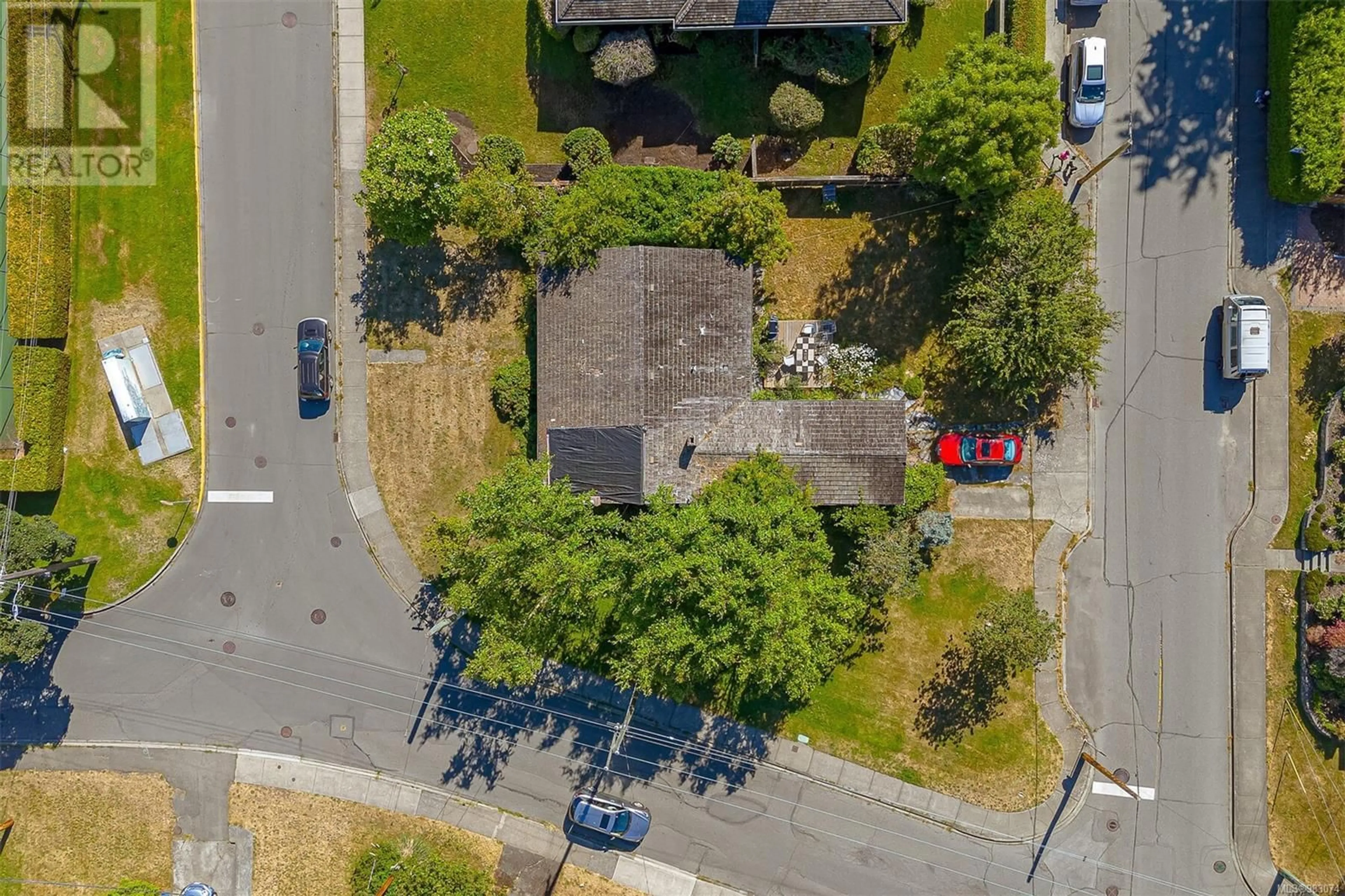 A pic from outside/outdoor area/front of a property/back of a property/a pic from drone, street for 2409 Currie Rd, Oak Bay British Columbia V8S3B5