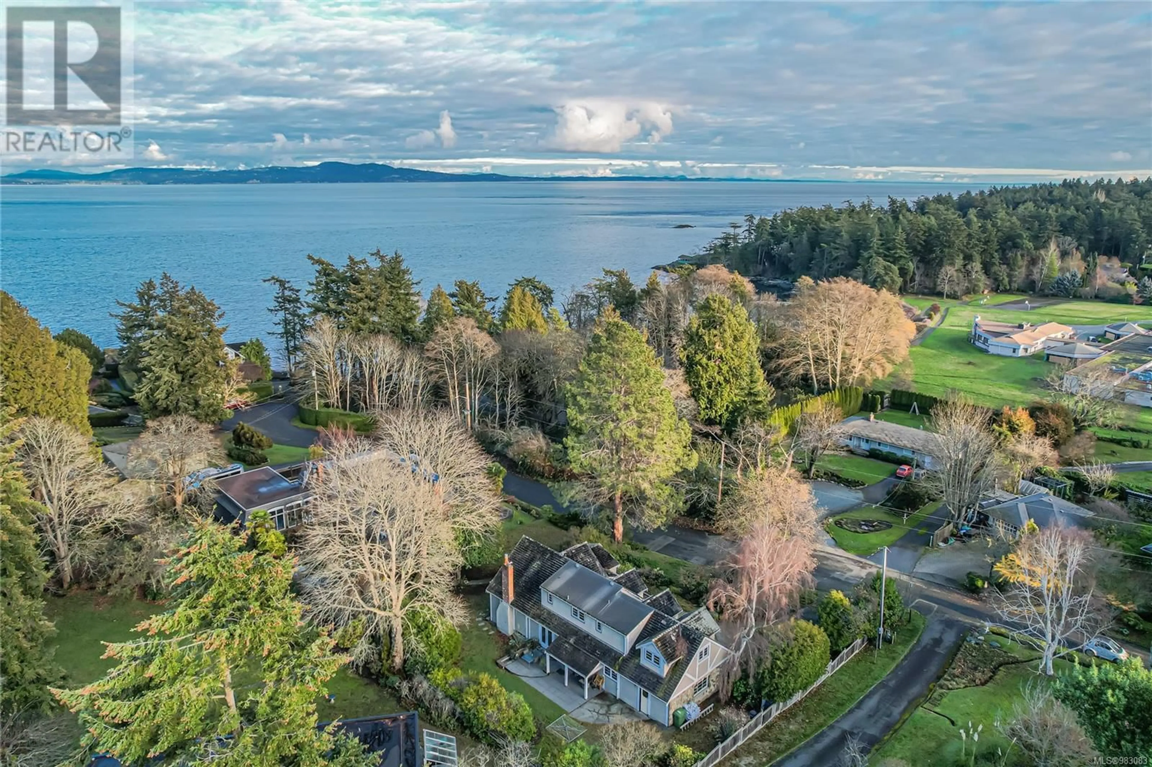 A pic from outside/outdoor area/front of a property/back of a property/a pic from drone, water/lake/river/ocean view for 4018 Locarno Lane, Saanich British Columbia V8N4A1