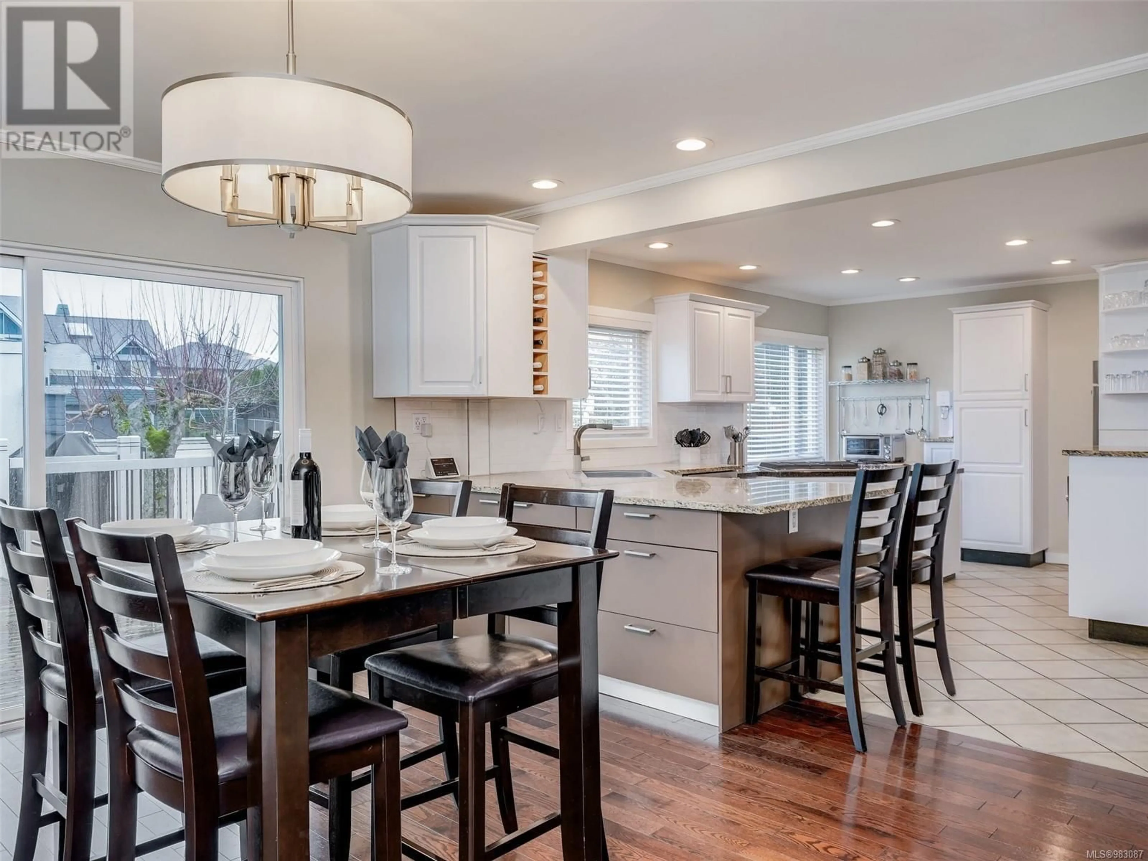 Open concept kitchen, wood/laminate floor for 4447 Narvaez Cres, Saanich British Columbia V8N2S7