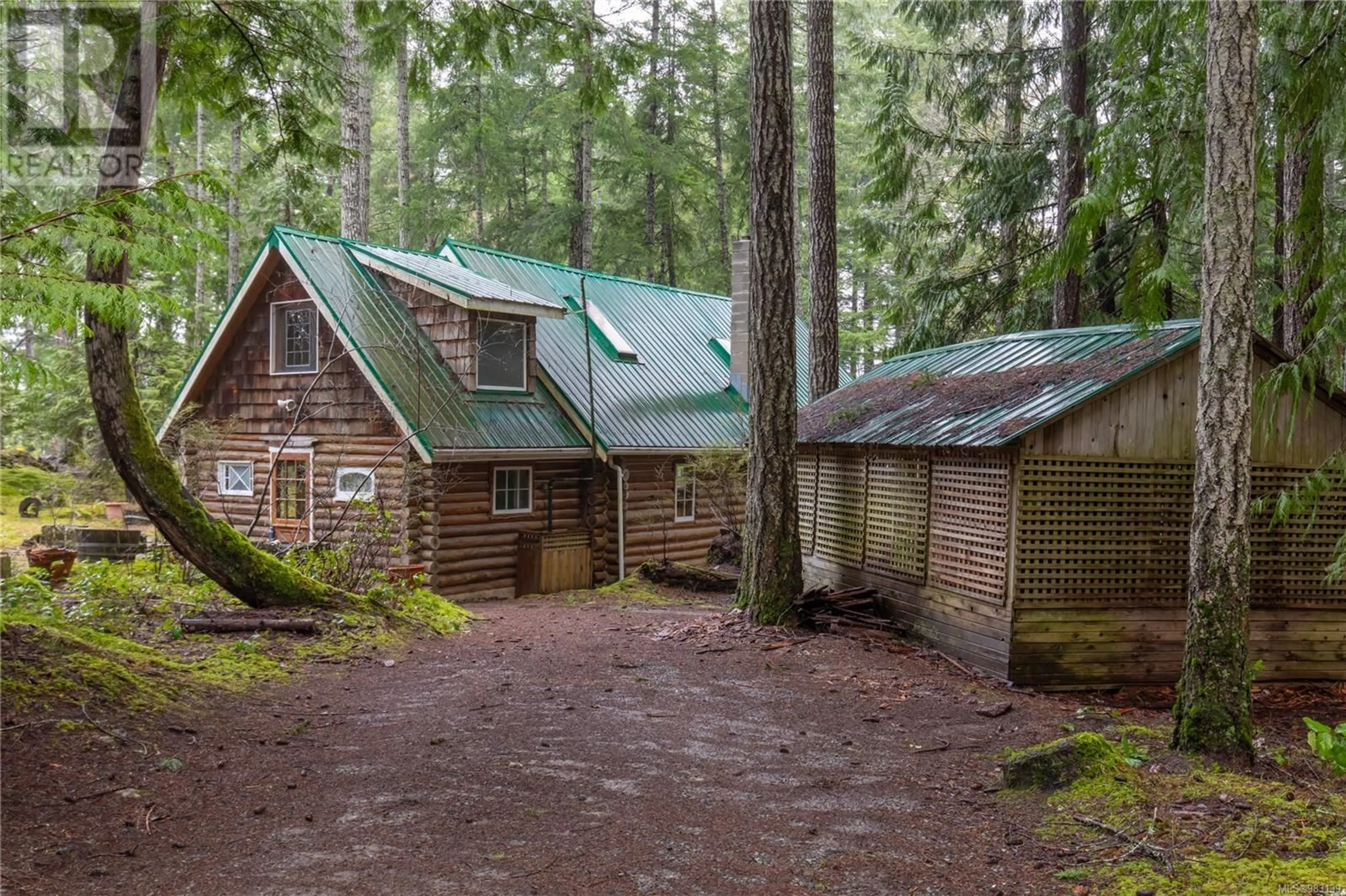 A pic from outside/outdoor area/front of a property/back of a property/a pic from drone, forest/trees view for 5100 Northwest Rd, Denman Island British Columbia V0R1T0