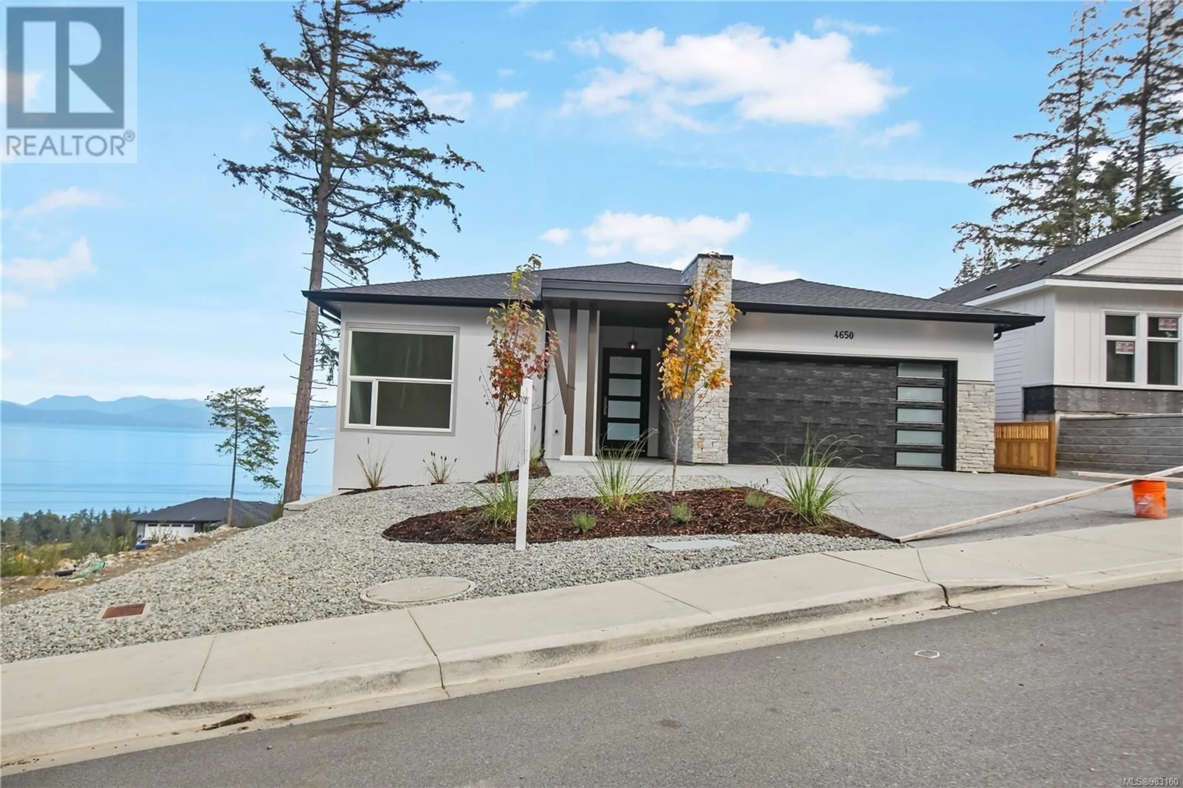 Home with brick exterior material, street for 4650 Ambience Dr, Nanaimo British Columbia V9T0L3