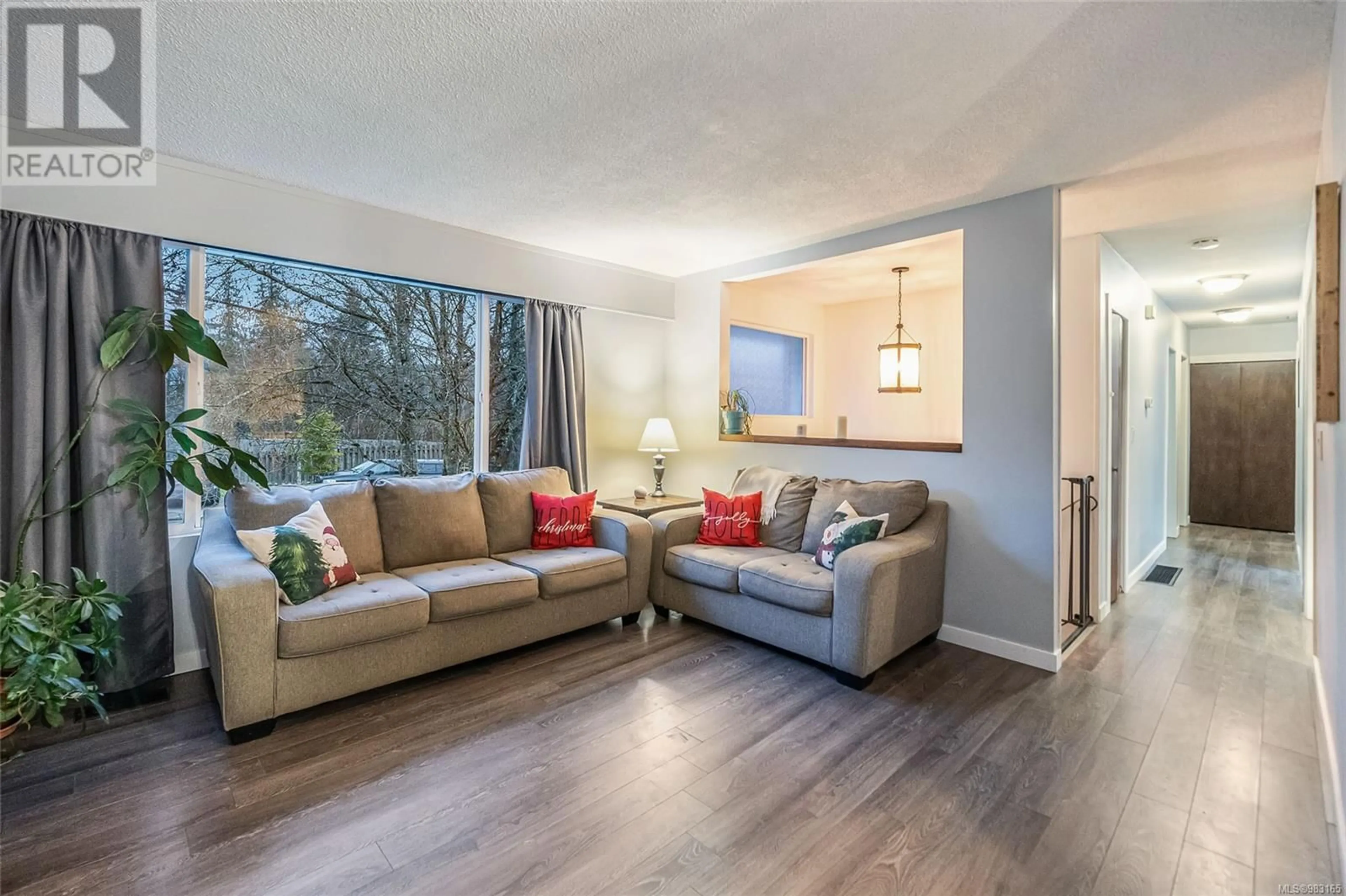 Living room with furniture, wood/laminate floor for 1636 Caspers Way, Nanaimo British Columbia V9S1K1