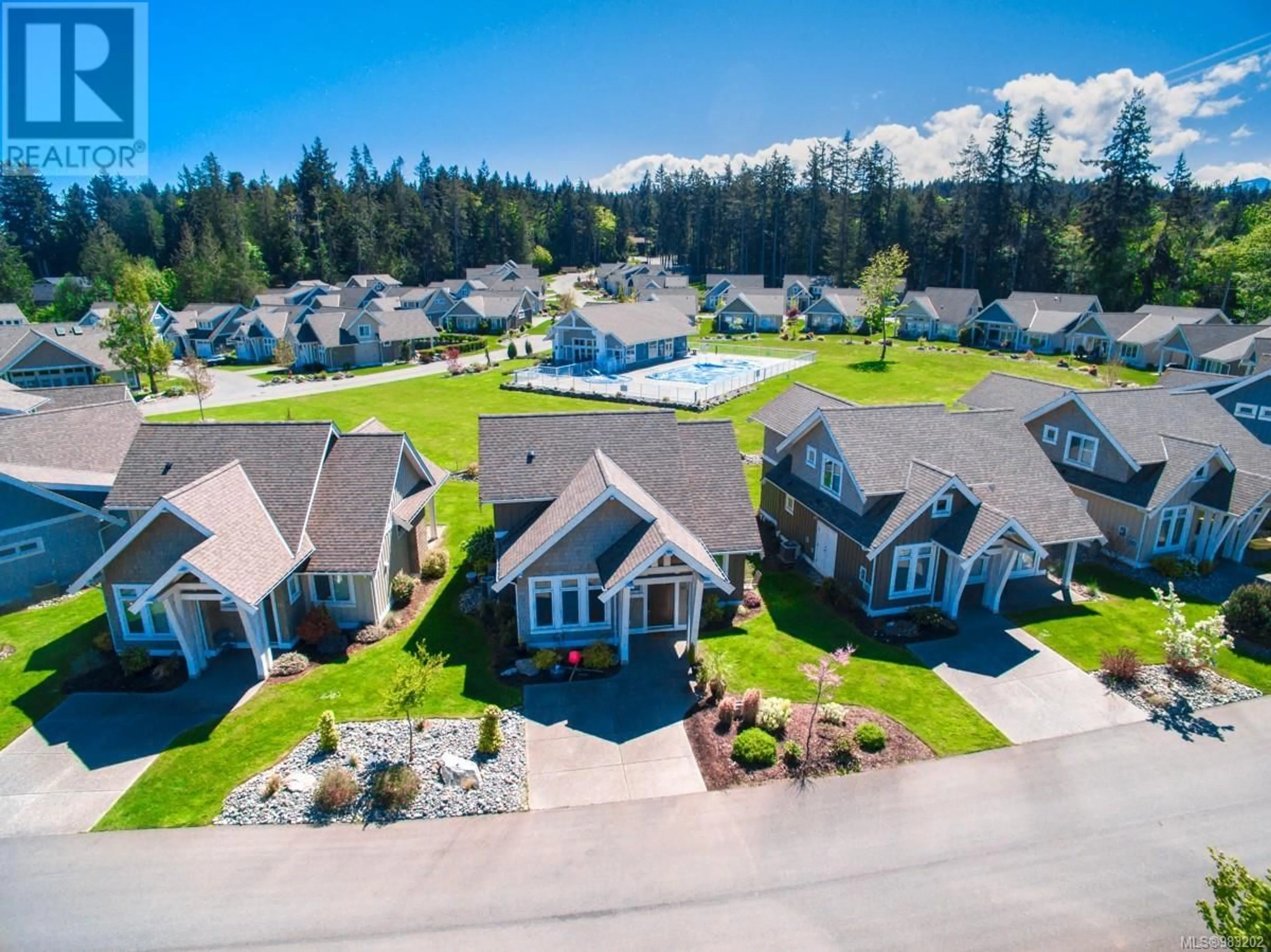 A pic from outside/outdoor area/front of a property/back of a property/a pic from drone, mountain view for 15 5251 Island Hwy W, Qualicum Beach British Columbia V9K2C1