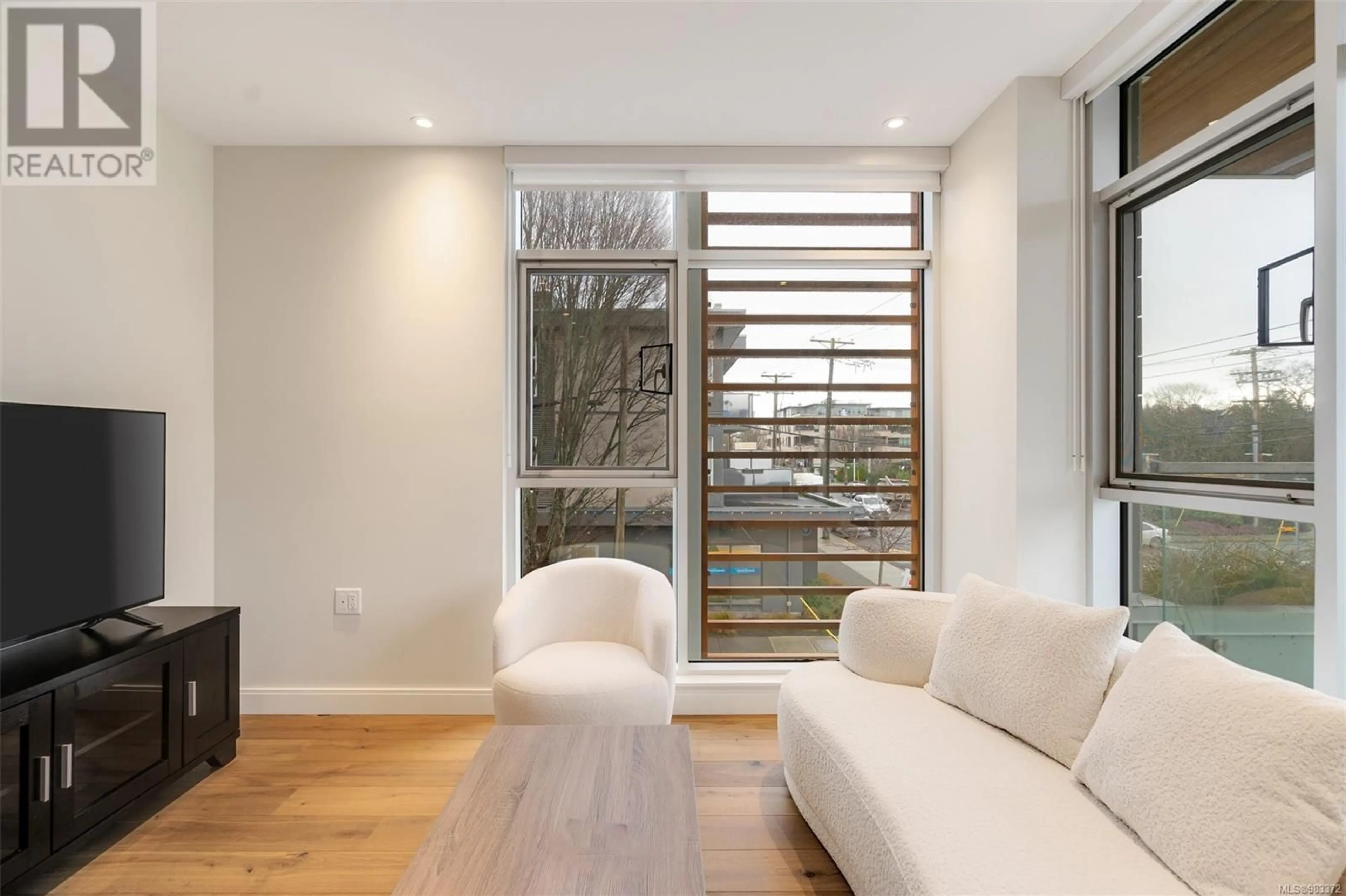 Living room with furniture, wood/laminate floor for 205 1916 Oak Bay Ave, Victoria British Columbia V8R1C7