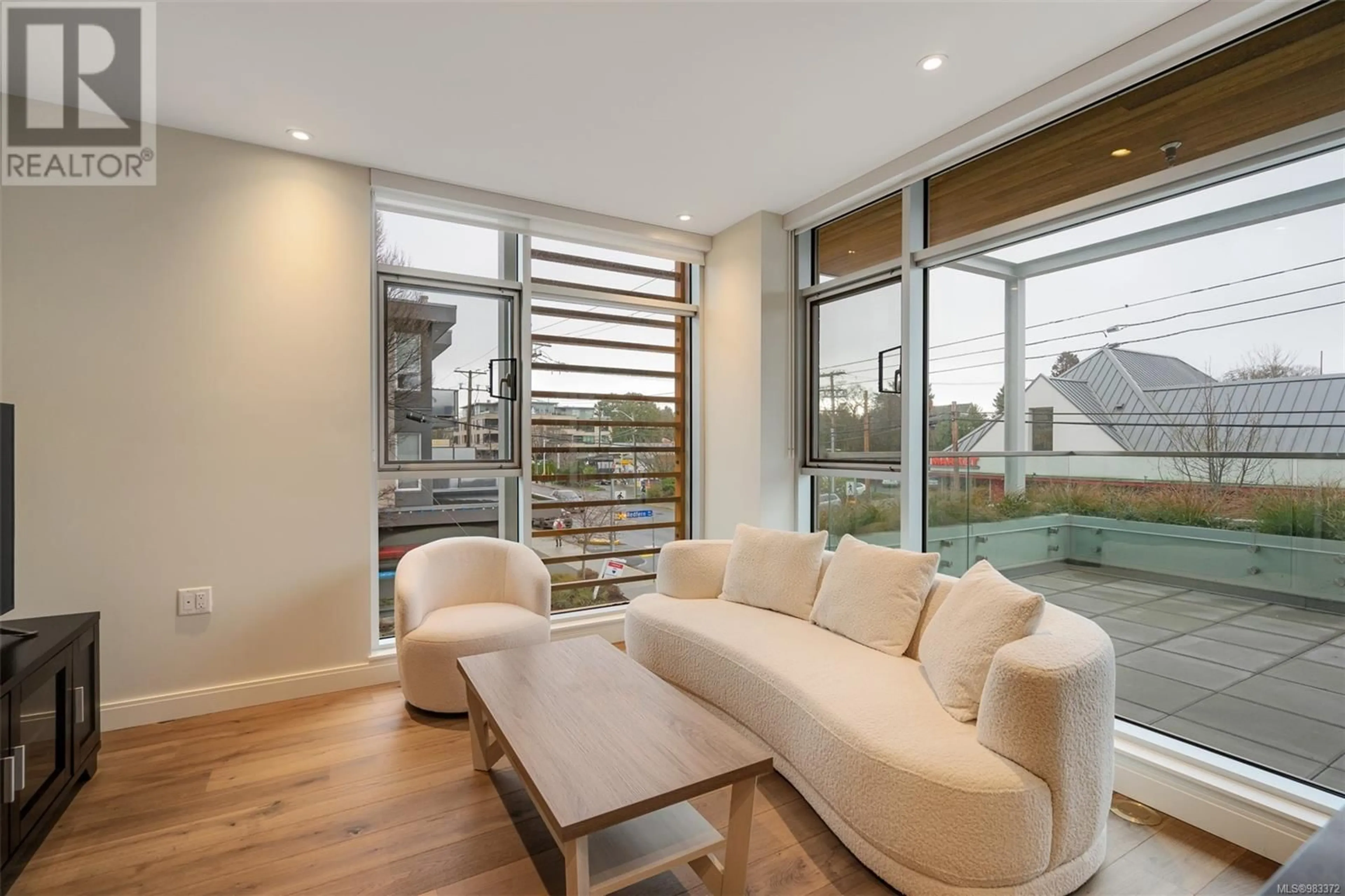 Living room with furniture, wood/laminate floor for 205 1916 Oak Bay Ave, Victoria British Columbia V8R1C7