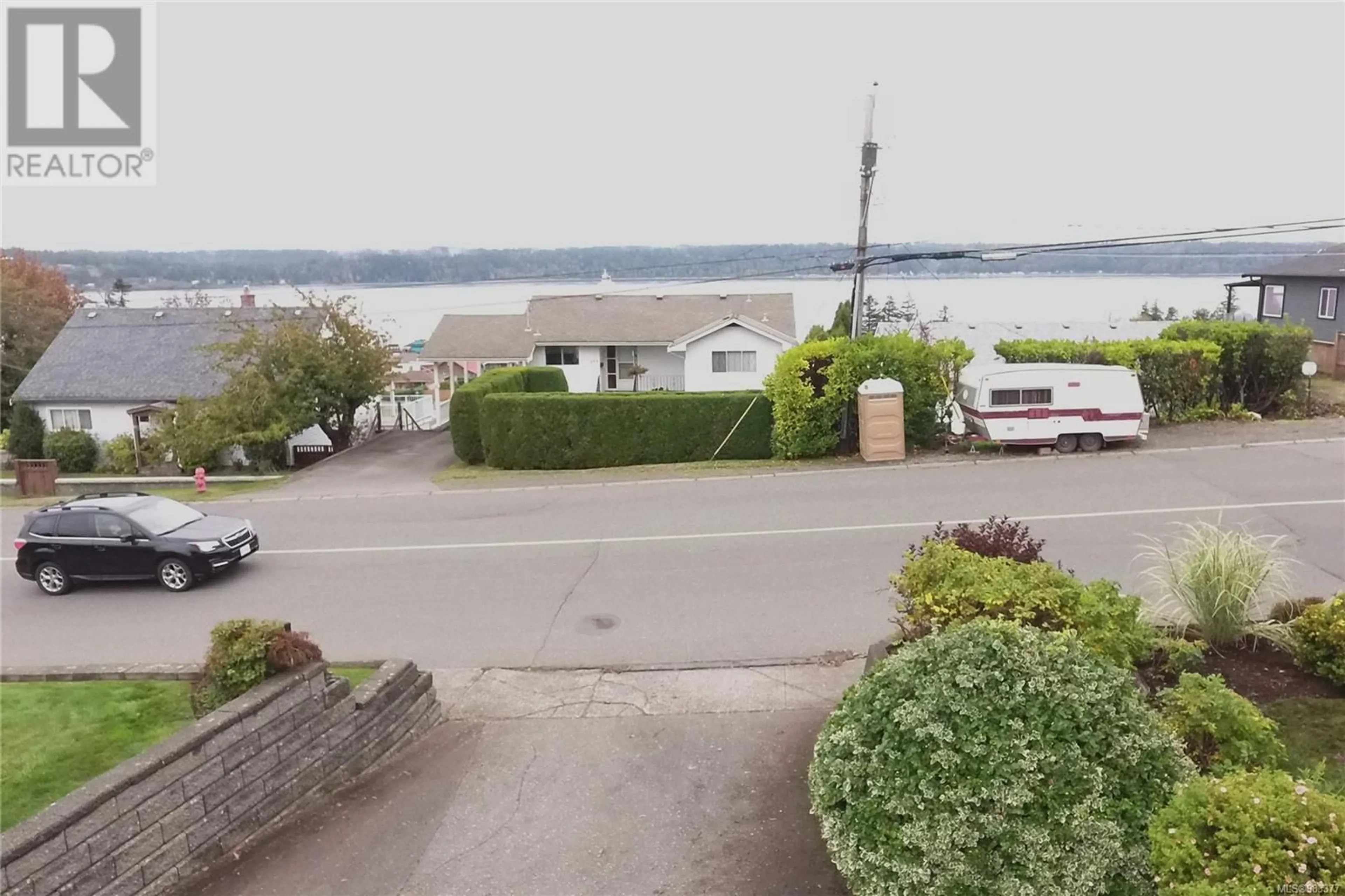 A pic from outside/outdoor area/front of a property/back of a property/a pic from drone, water/lake/river/ocean view for 588 Alder St, Campbell River British Columbia V9W2P1