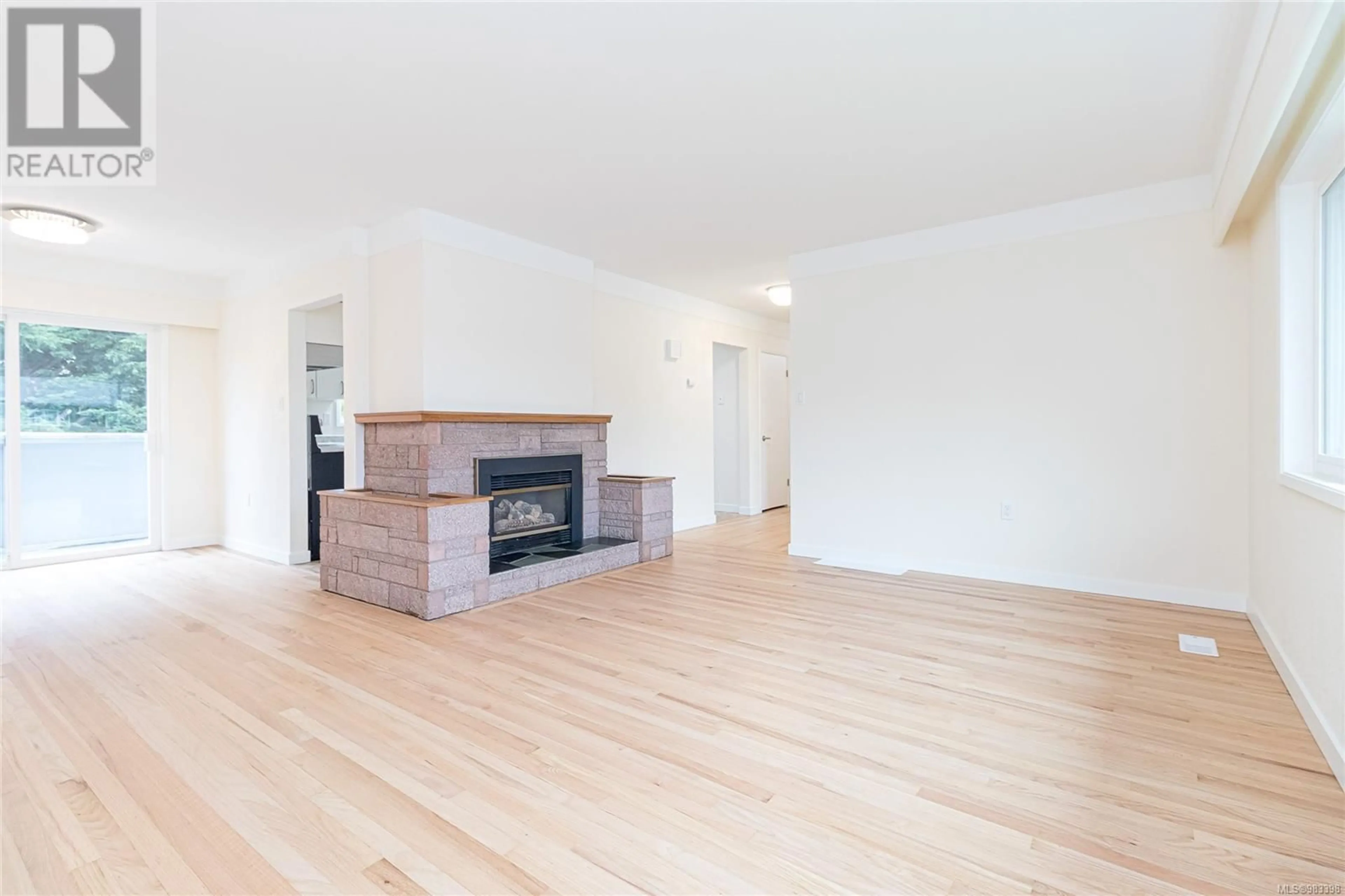 Living room with furniture, wood/laminate floor for 3315 Keats St, Saanich British Columbia V8P4B2