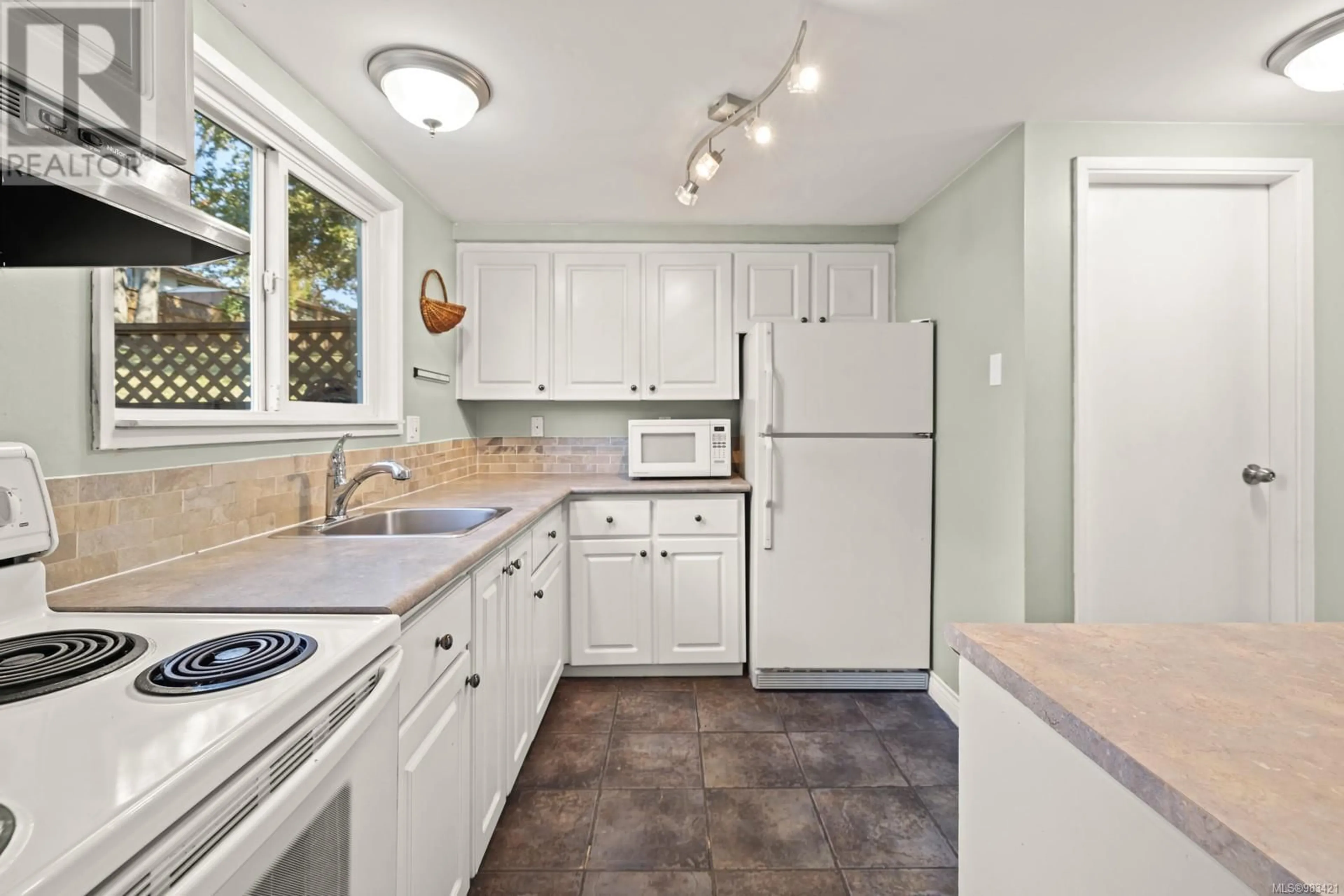 Standard kitchen, ceramic/tile floor for 16 3981 Nelthorpe St, Saanich British Columbia V8X3Z2