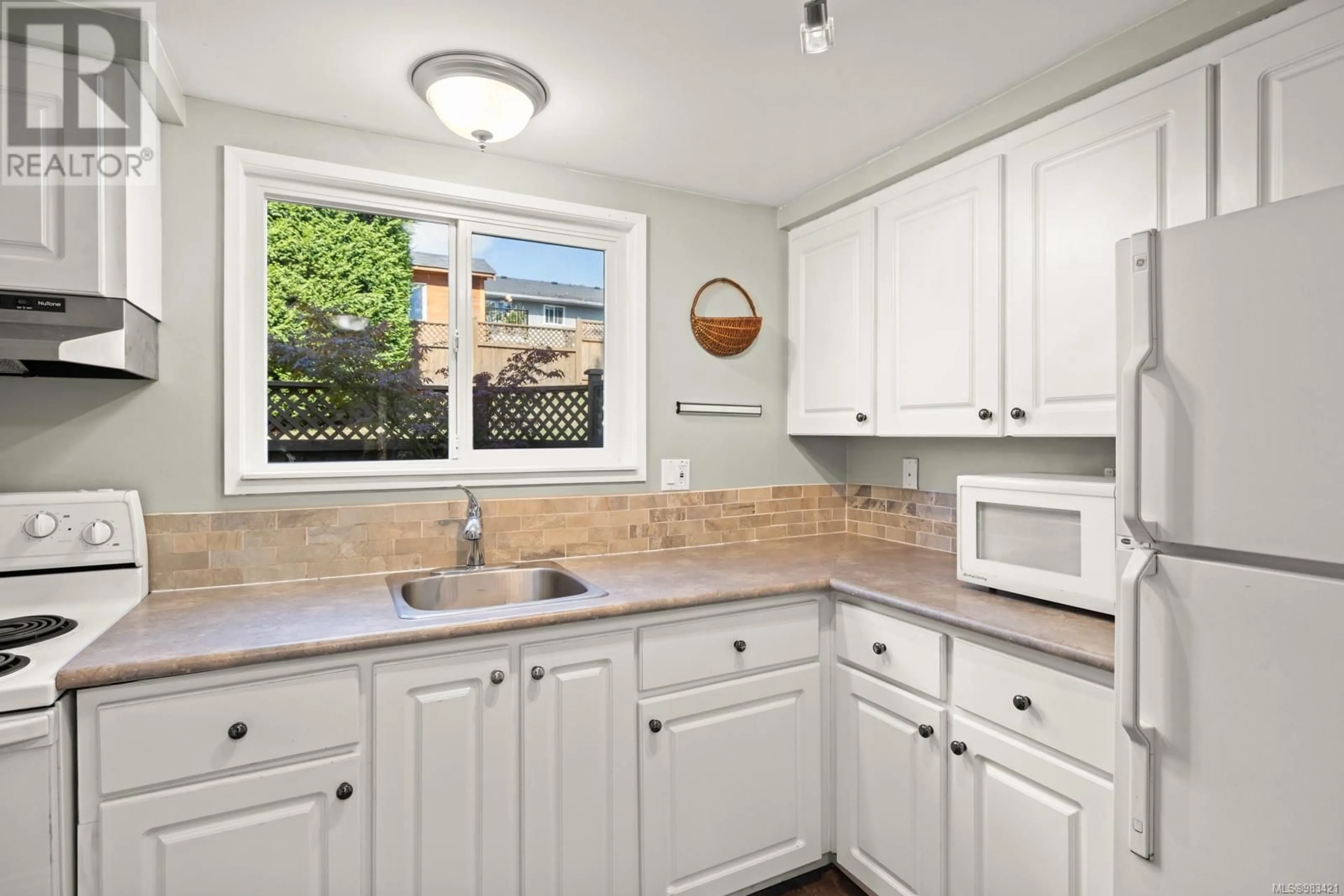 Standard kitchen, ceramic/tile floor for 16 3981 Nelthorpe St, Saanich British Columbia V8X3Z2