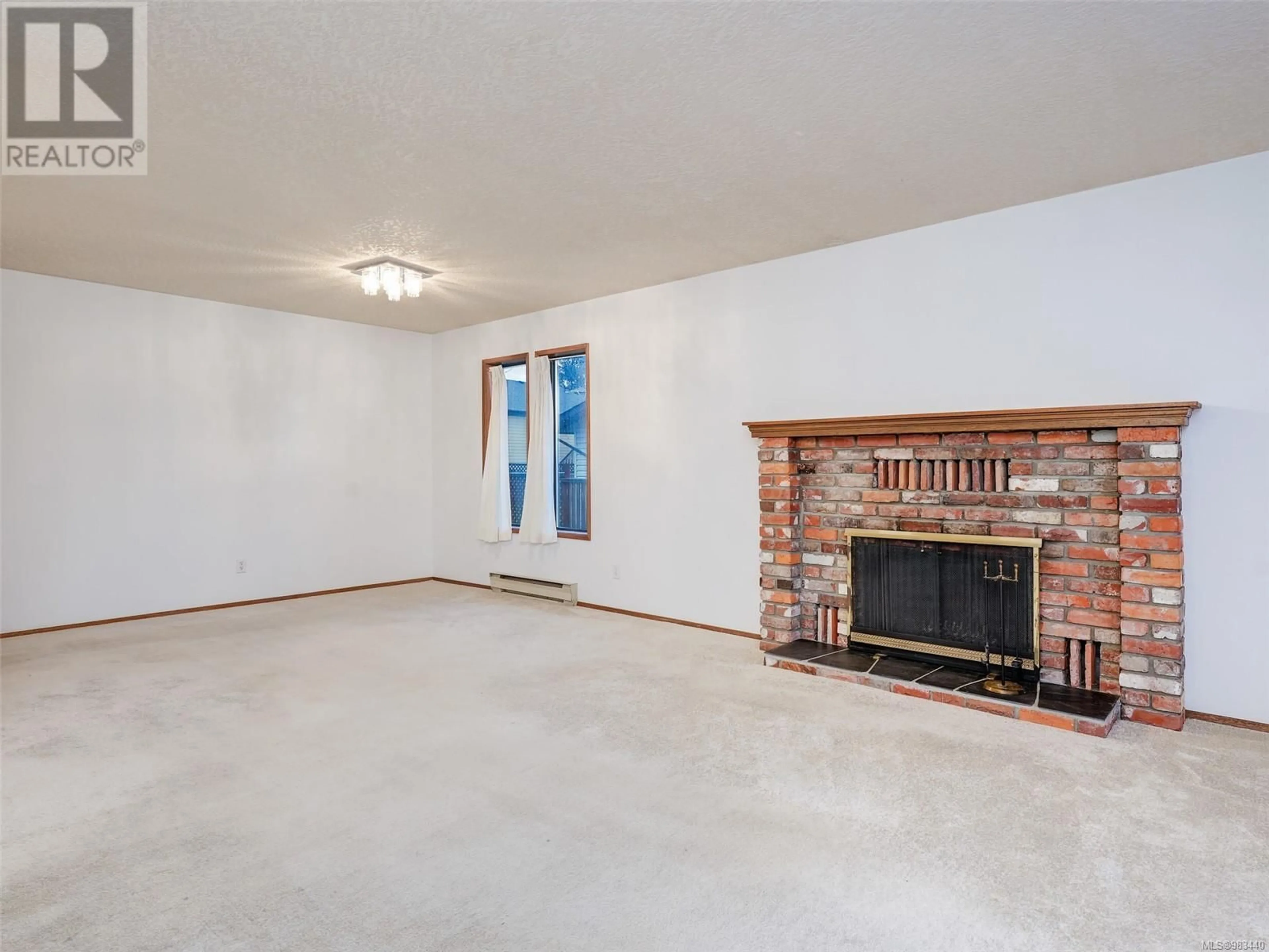 Living room with furniture, unknown for 4253 Quadra St, Saanich British Columbia V8X1L5