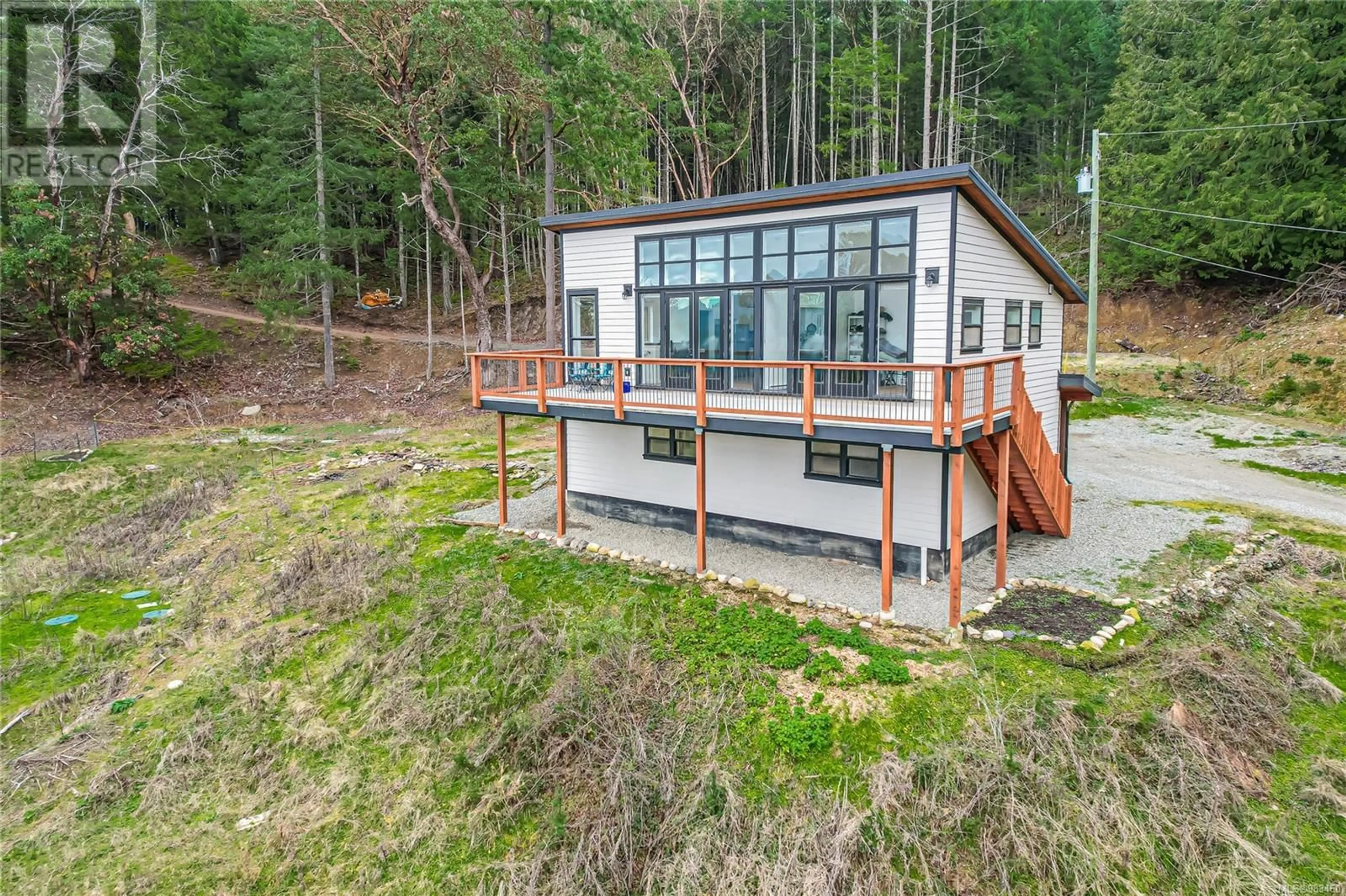 A pic from outside/outdoor area/front of a property/back of a property/a pic from drone, unknown for 879 Rainbow Rd, Salt Spring British Columbia V8K2M8