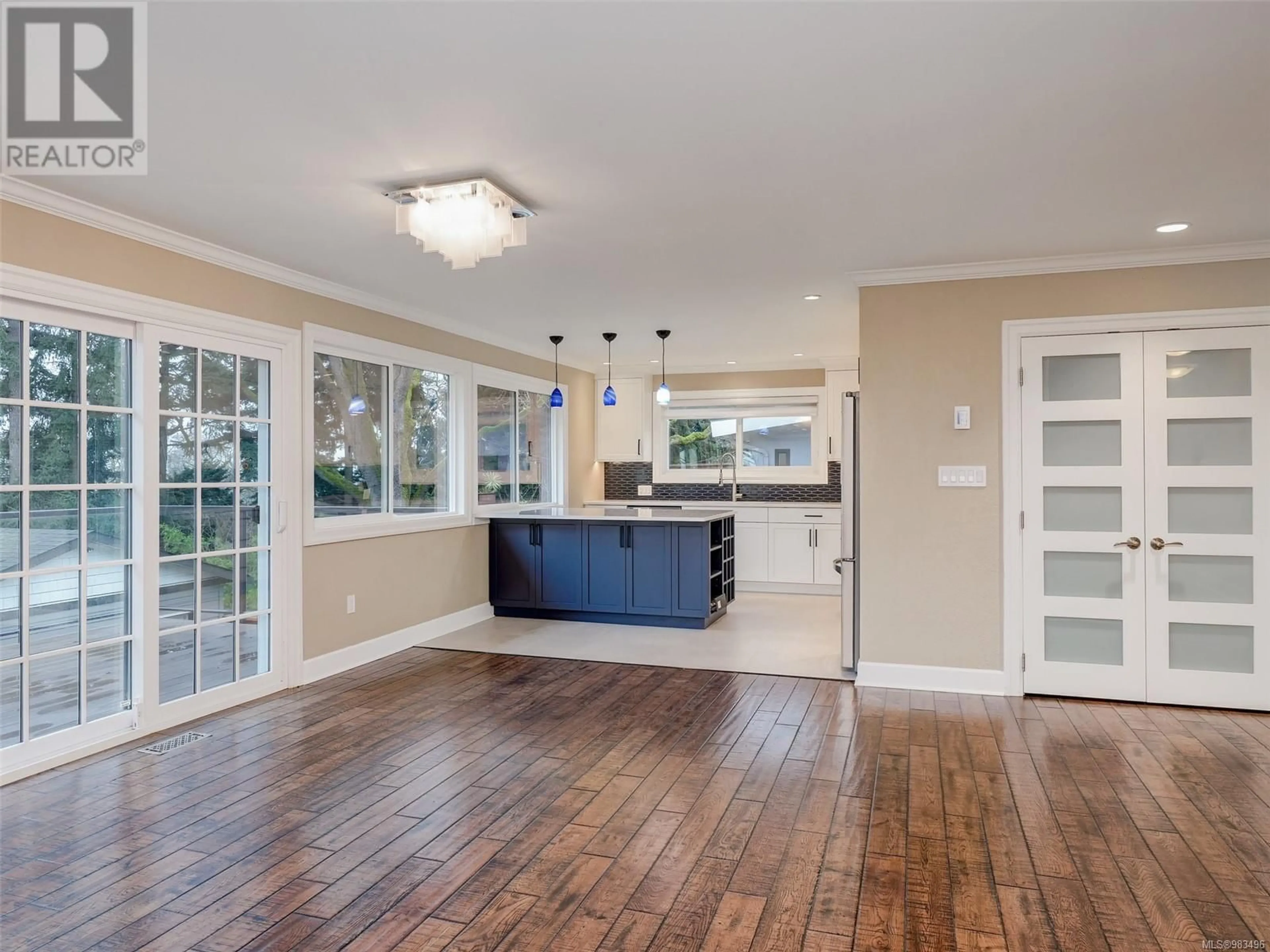 Open concept kitchen, wood/laminate floor for 1331 Topaz Ave, Victoria British Columbia V8T4Z2