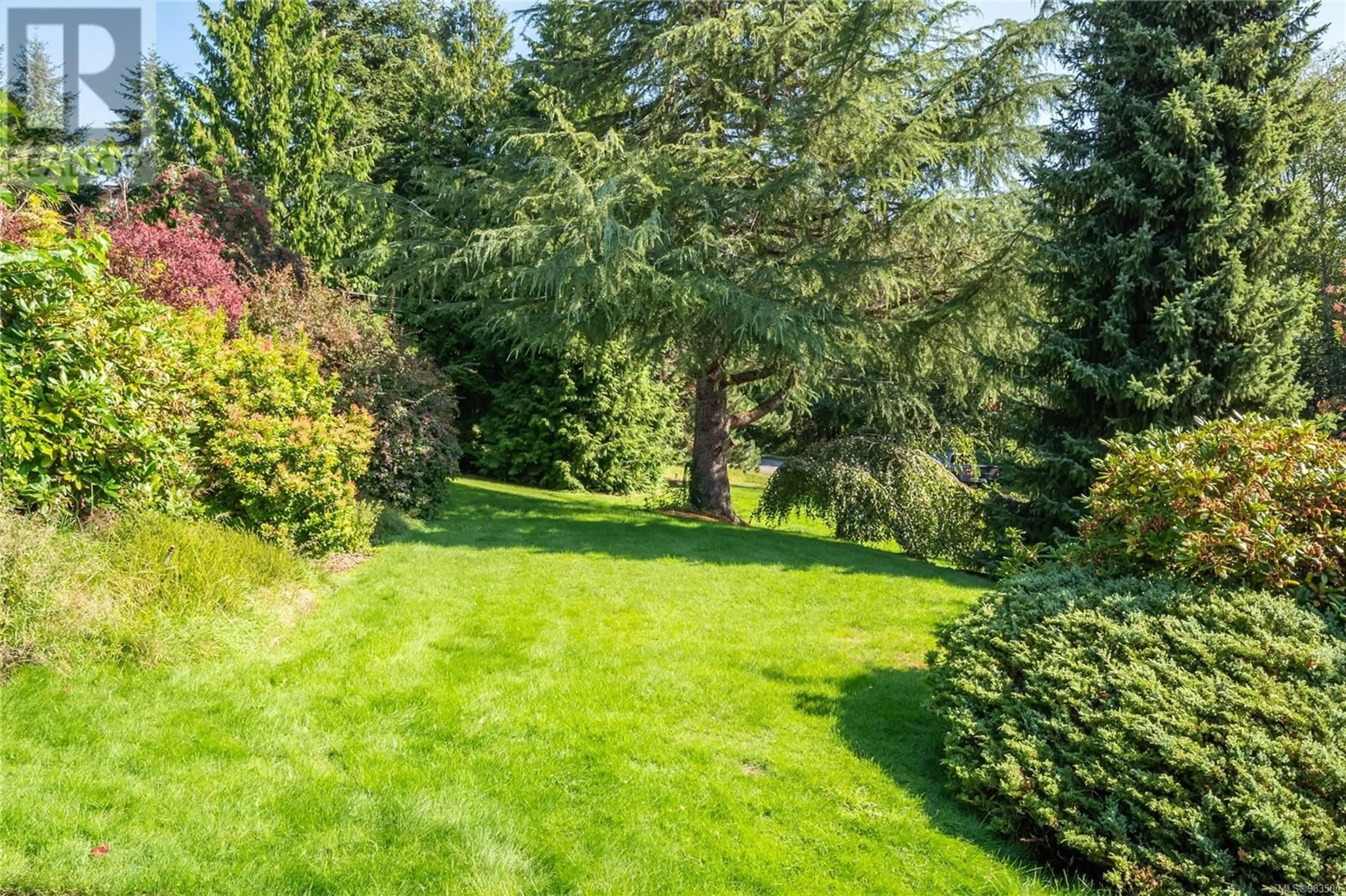 A pic from outside/outdoor area/front of a property/back of a property/a pic from drone, forest/trees view for 11074 Larkspur Lane, North Saanich British Columbia V8L5N6