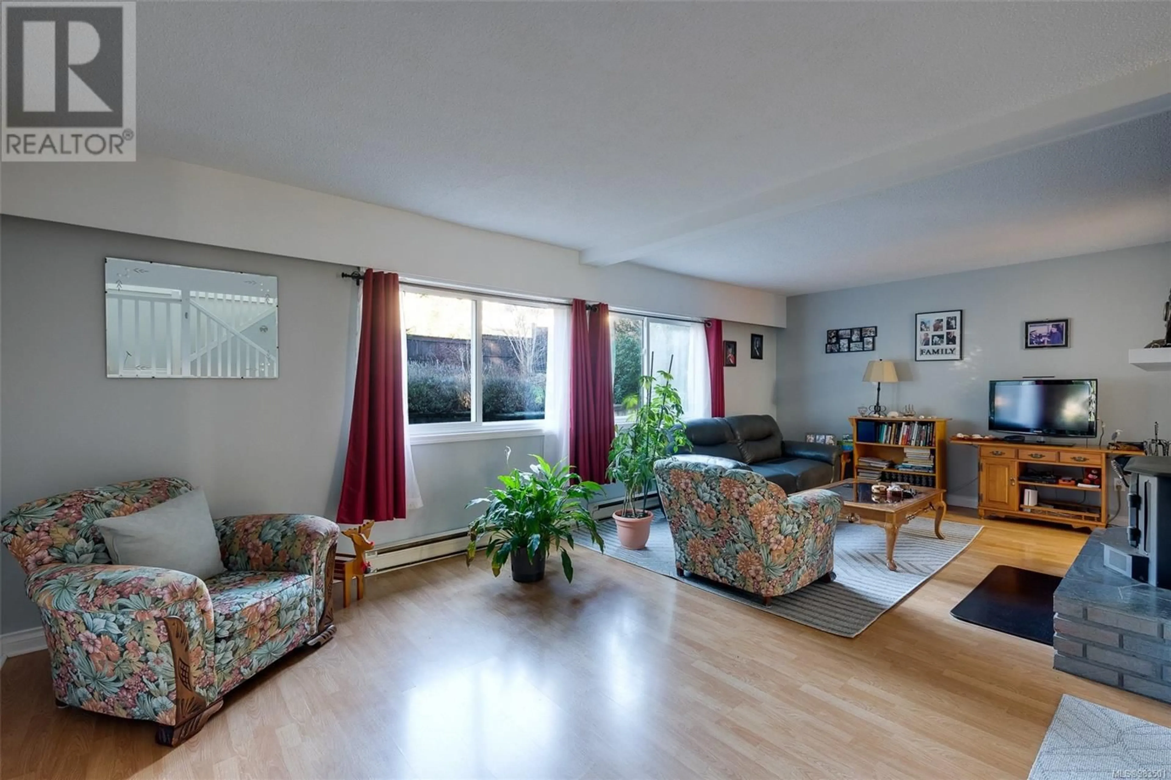 Living room with furniture, wood/laminate floor for 2311 Galena Rd, Sooke British Columbia V9Z0M4