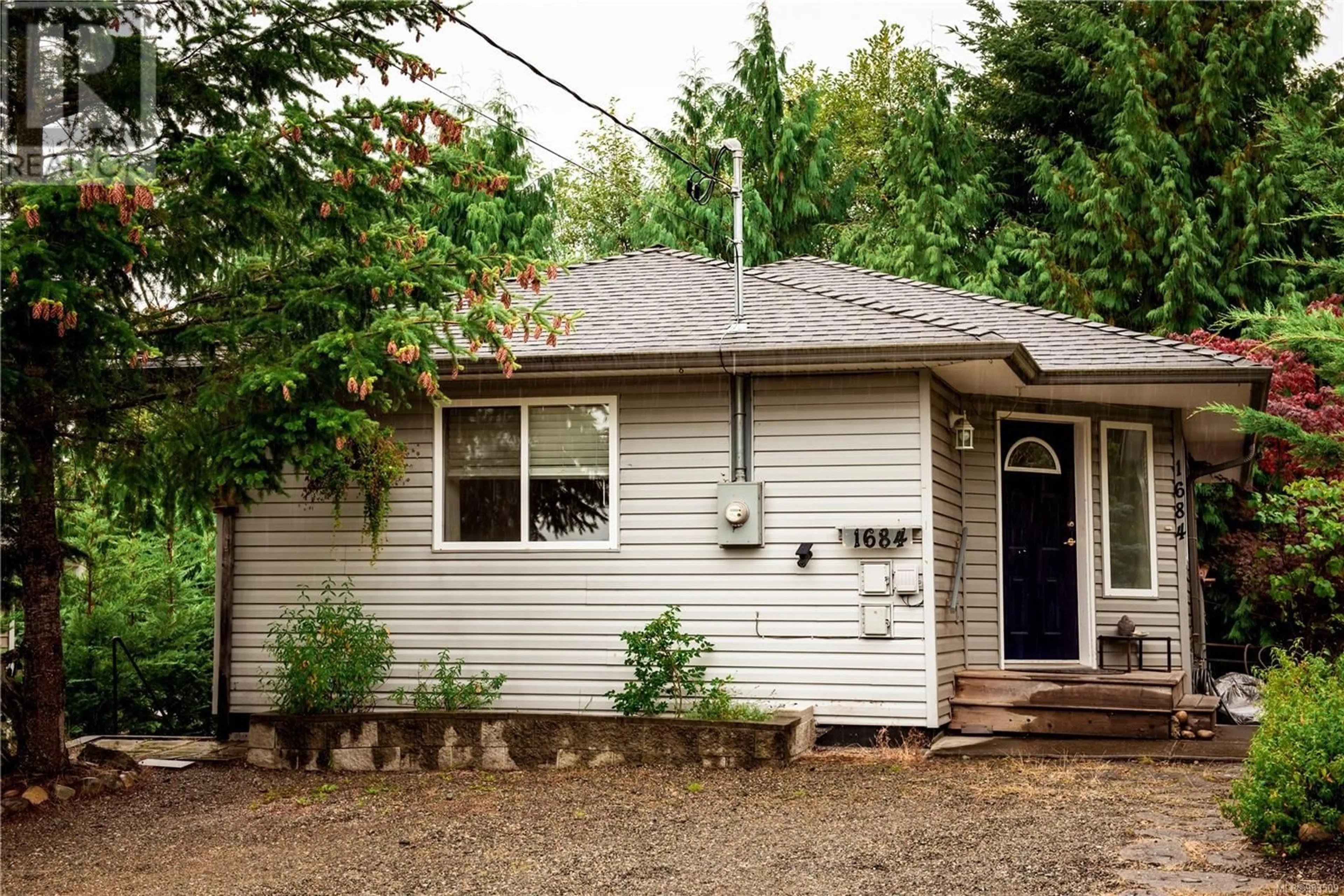 Home with vinyl exterior material, street for 1684 Lailah's Loop, Qualicum Beach British Columbia V9K2S3