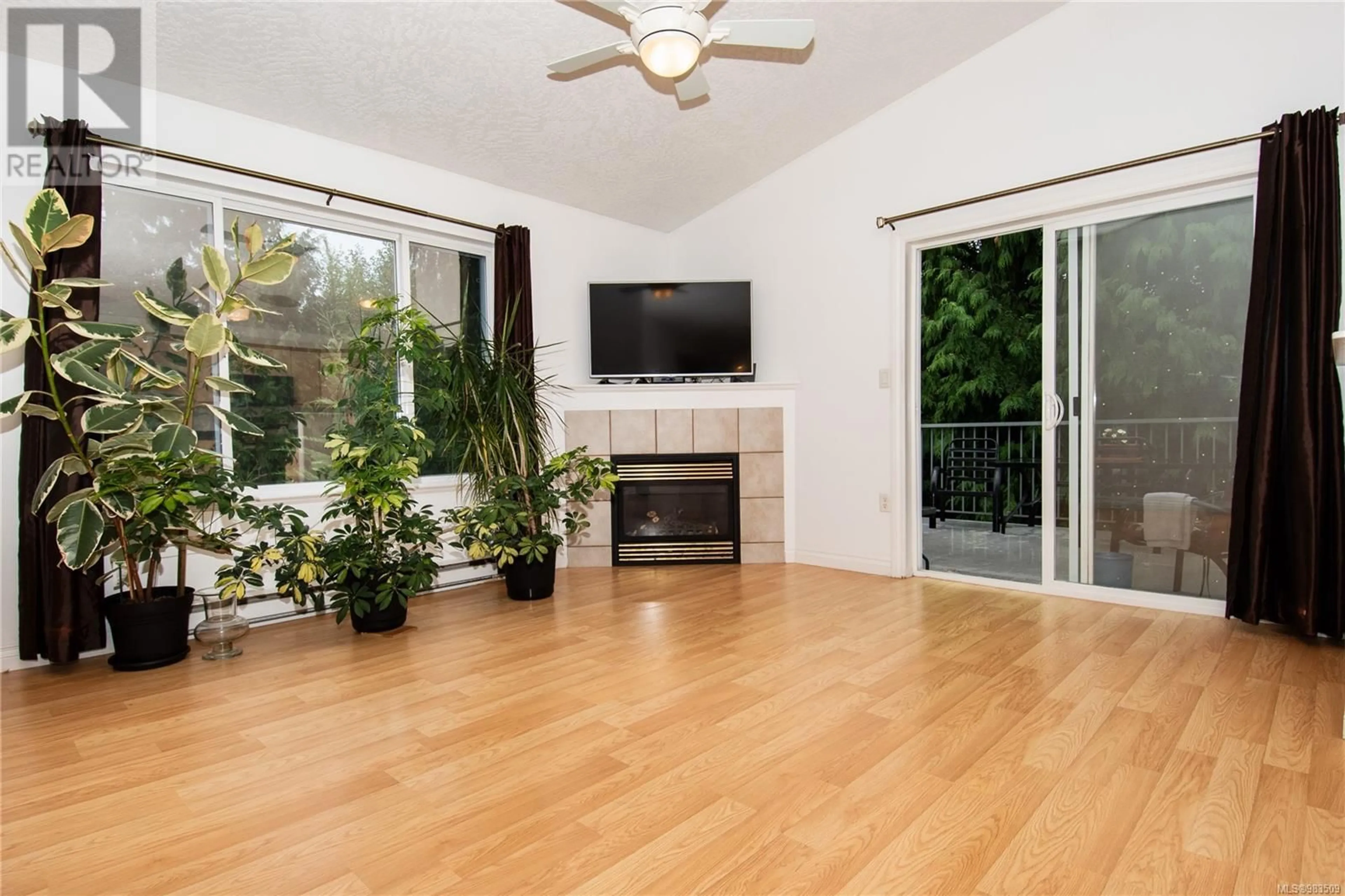 Living room with furniture, wood/laminate floor for 1684 Lailah's Loop, Qualicum Beach British Columbia V9K2S3