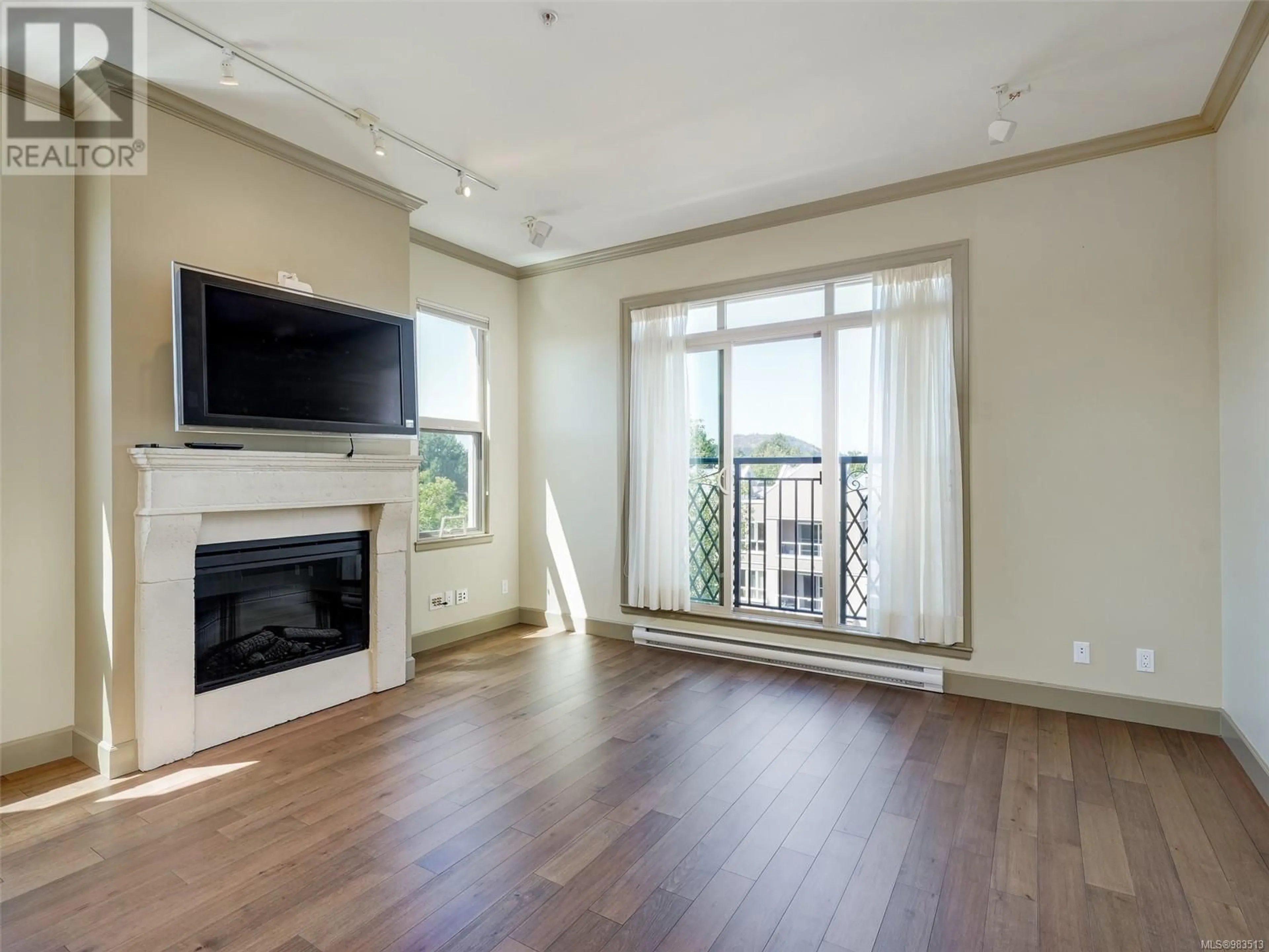 Living room with furniture, wood/laminate floor for 412 1620 McKenzie Ave, Saanich British Columbia V8N0A1