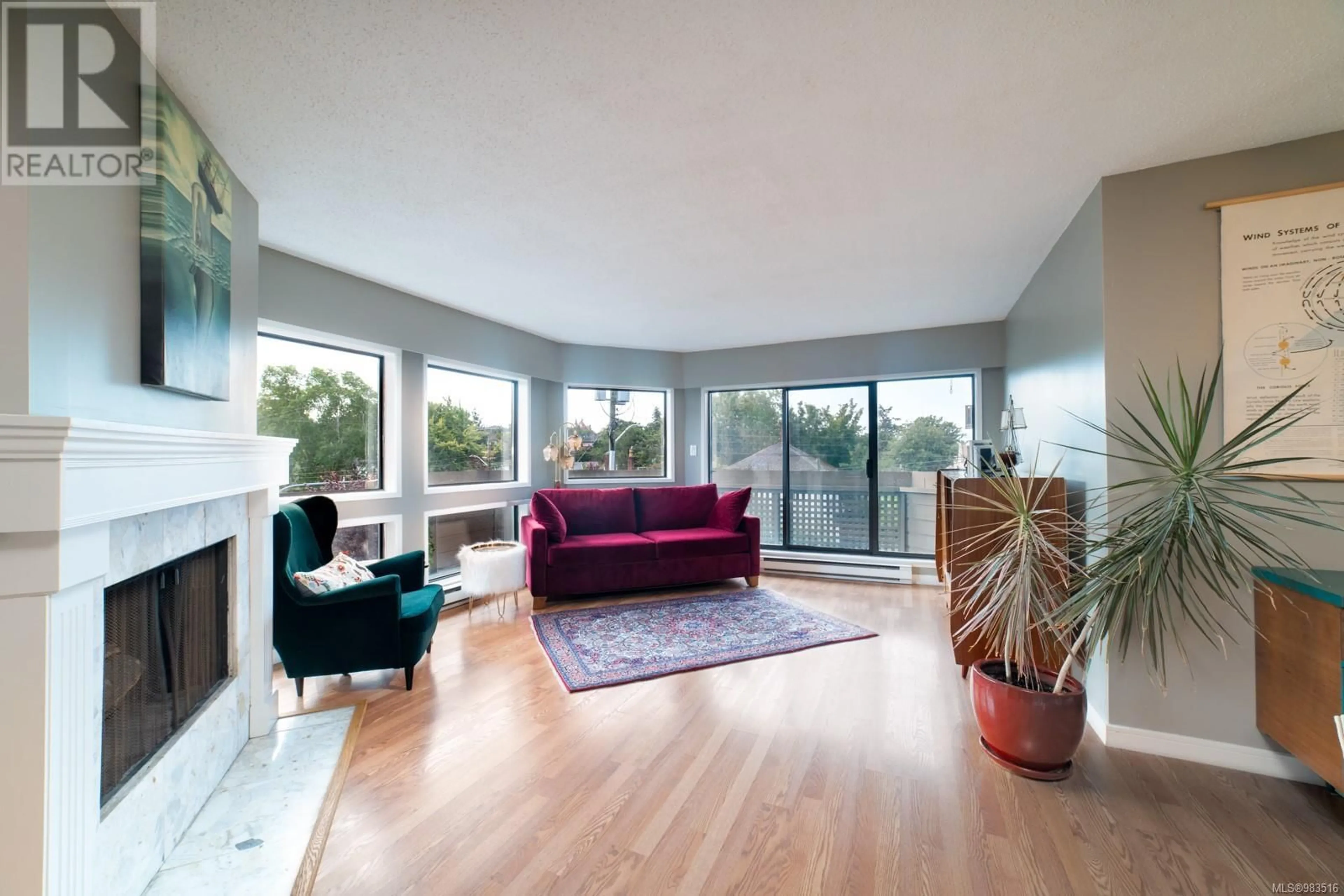 Living room with furniture, wood/laminate floor for 305 1252 Pandora Ave, Victoria British Columbia V8V3R4