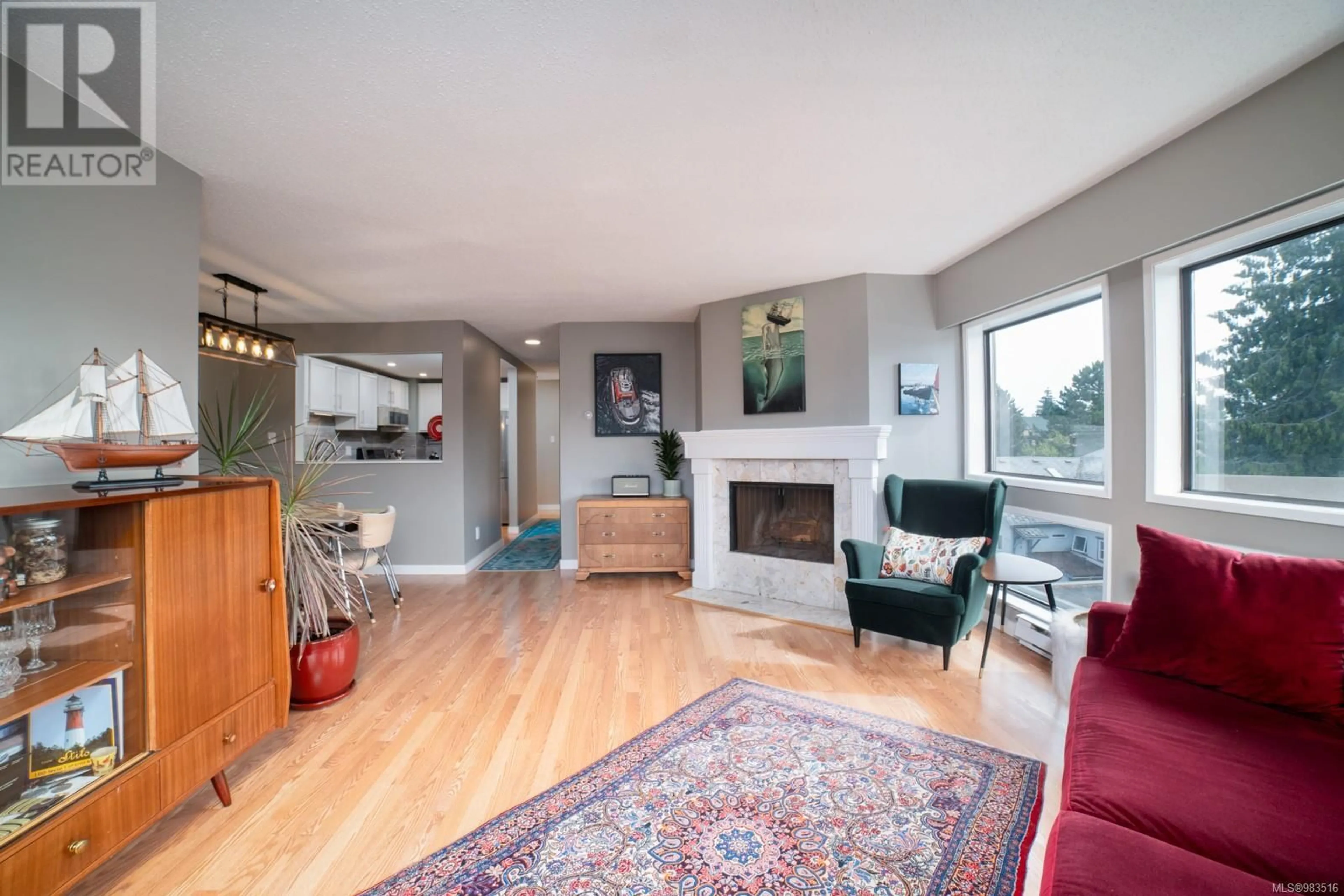 Living room with furniture, wood/laminate floor for 305 1252 Pandora Ave, Victoria British Columbia V8V3R4