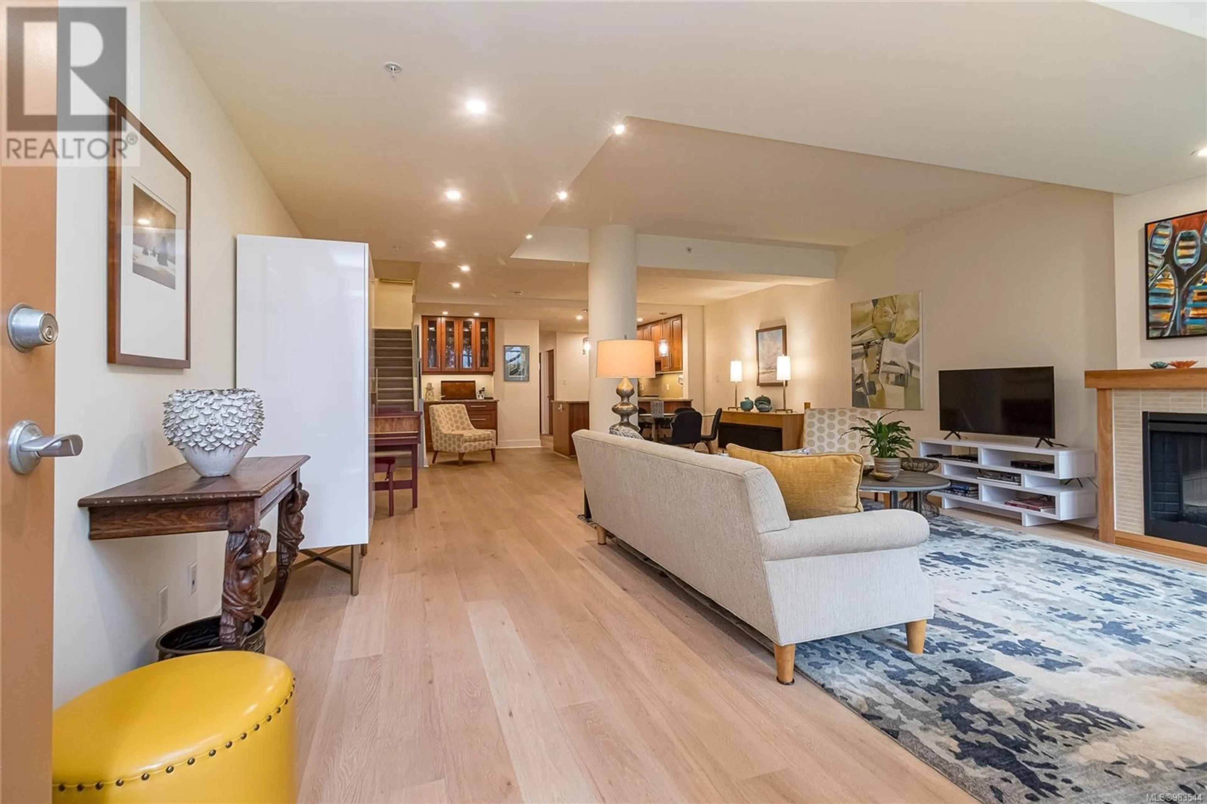 Living room with furniture, wood/laminate floor for 2 828 Rupert Terr, Victoria British Columbia V8W0A7